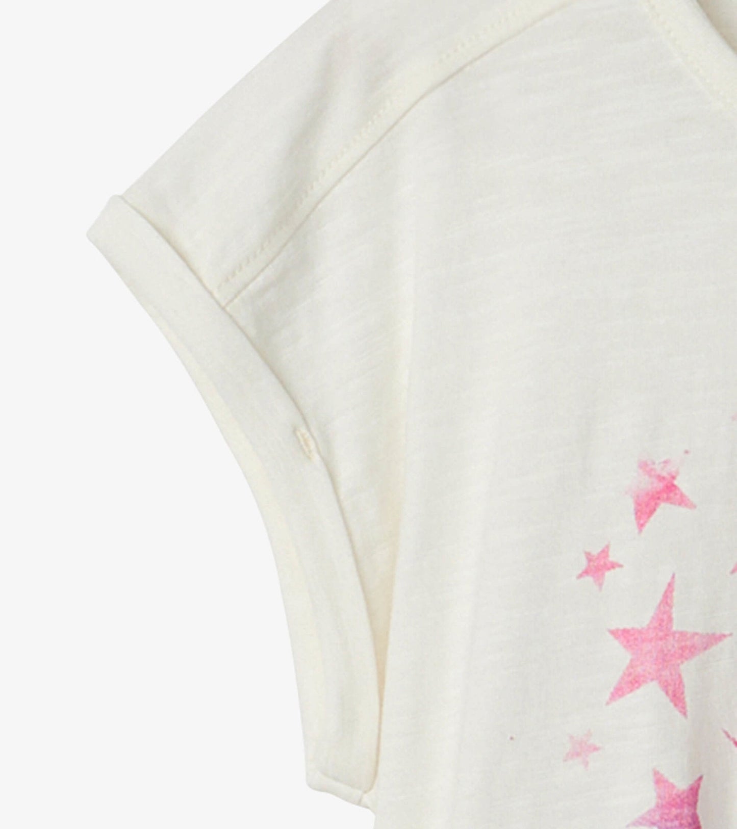 Cream relaxed t-shirt featuring a pink star graphic, short rolled sleeves, and a soft, lightweight fabric.