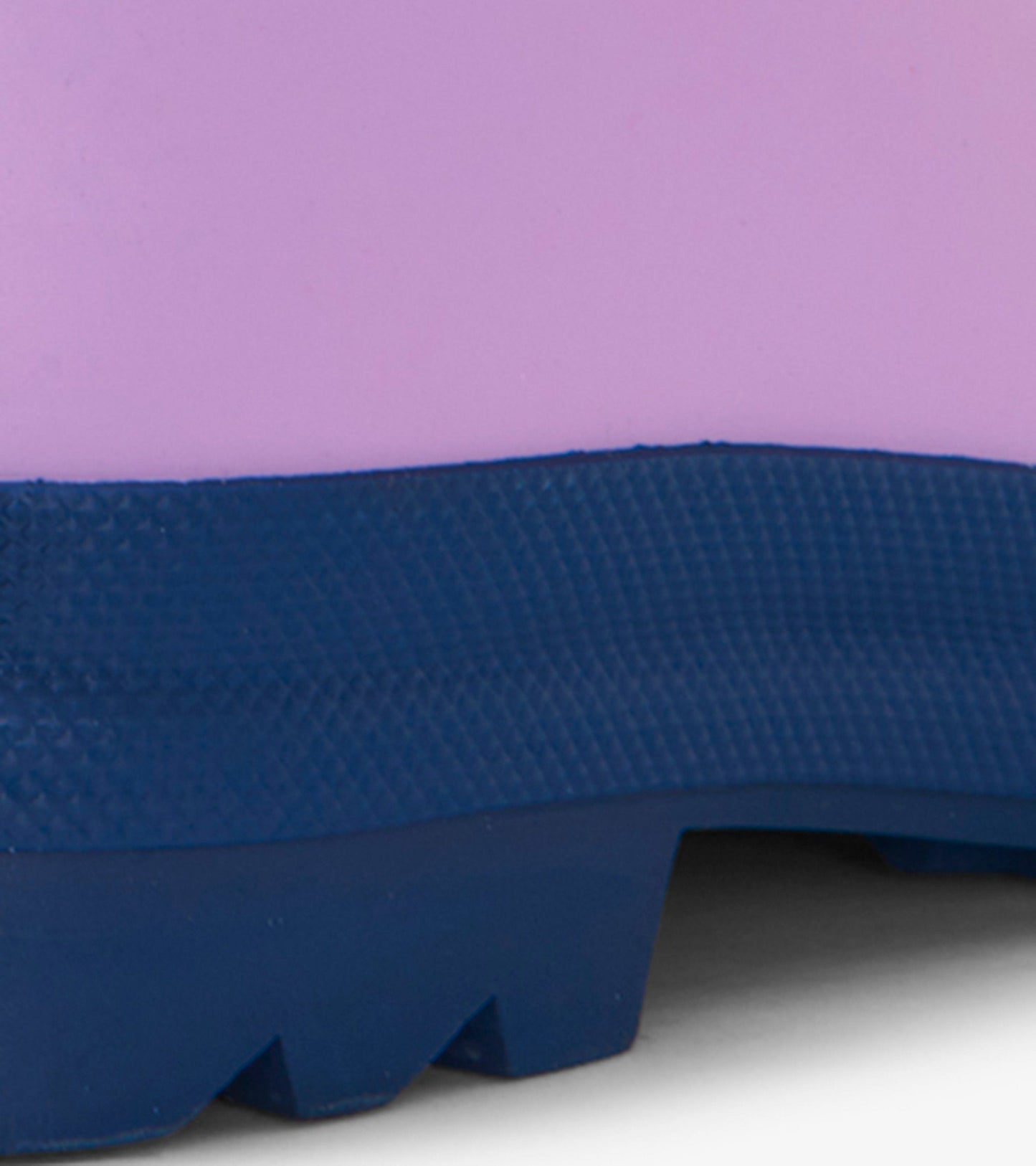 Lilac matte wellies with a navy rubber sole, featuring a textured surface for grip and durability.