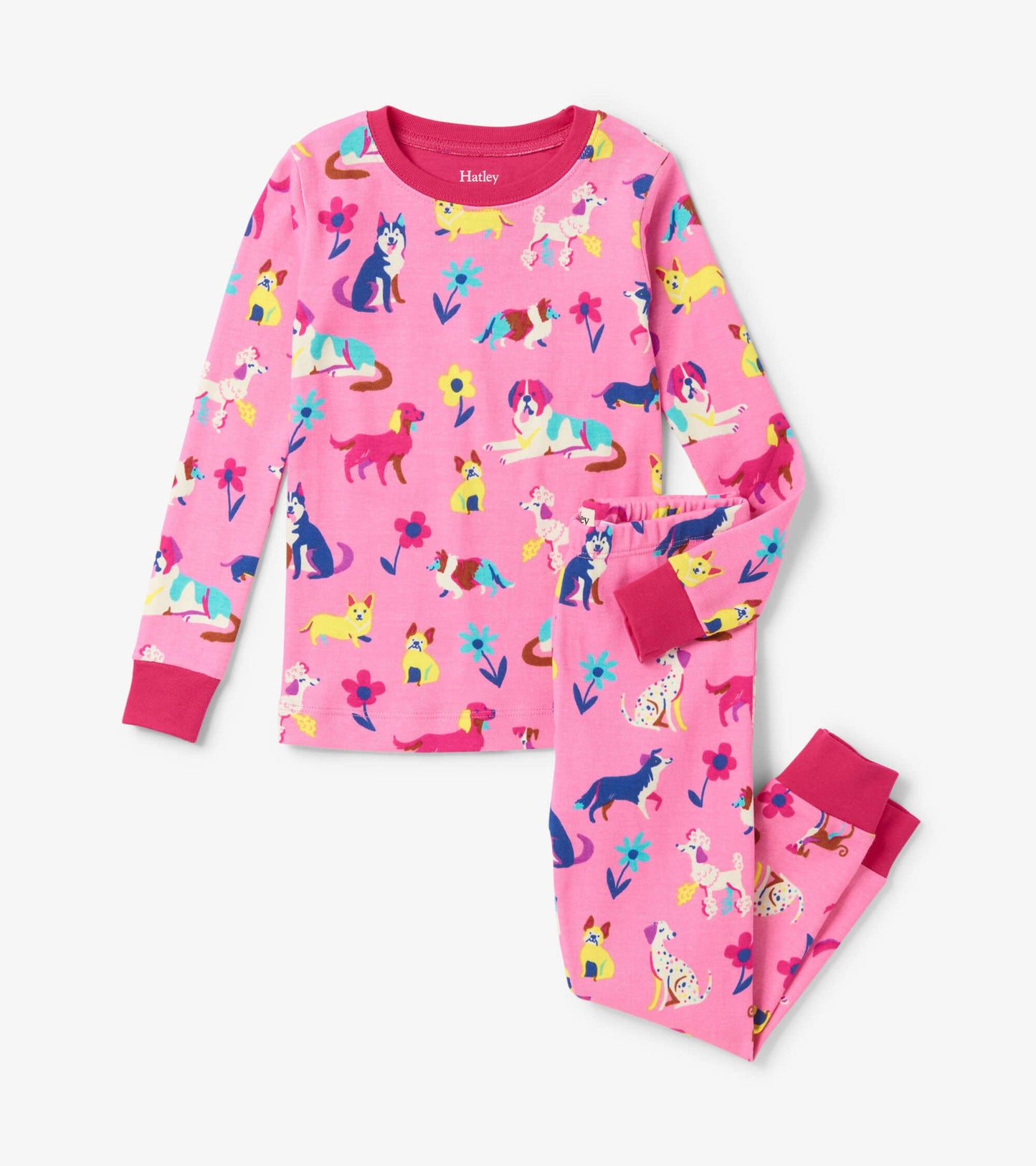 Pink pajama set featuring colorful dog and flower patterns, with long sleeves and elastic waistband.
