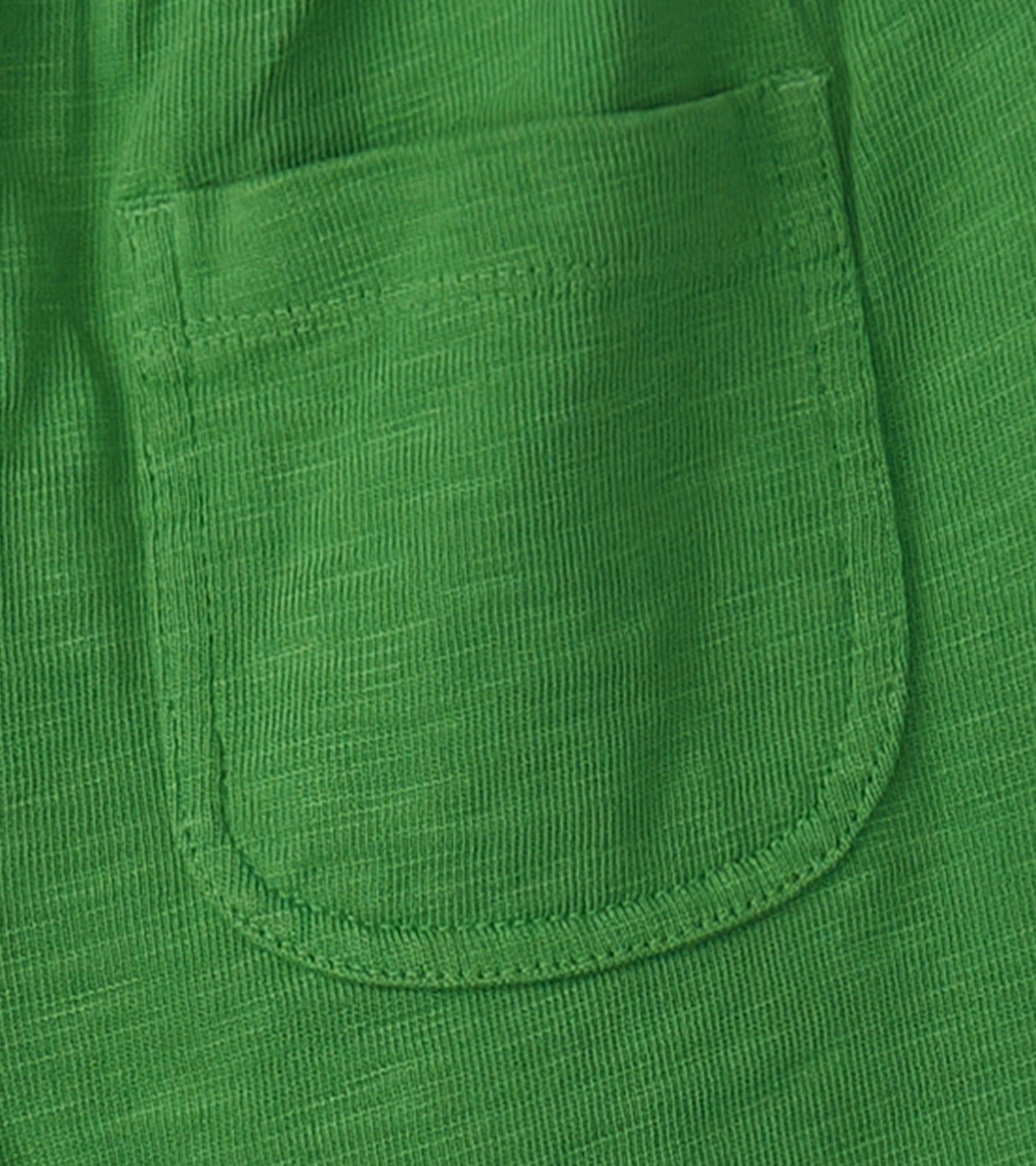 Green relaxed shorts featuring a back pocket, made from lightweight material suitable for outdoor activities.