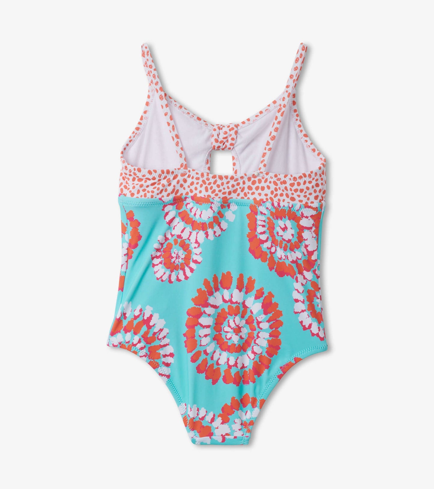 A tie-front swimsuit featuring a turquoise base with colorful painted mandalas in red and white.