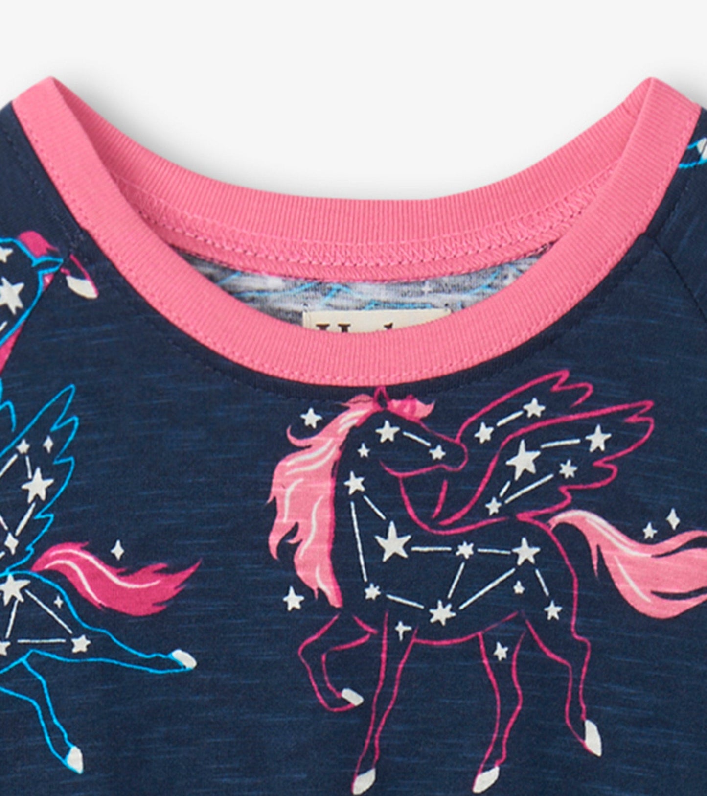 Navy dress featuring colorful unicorn constellations and a pink ribbed neckline, designed for playful wear.