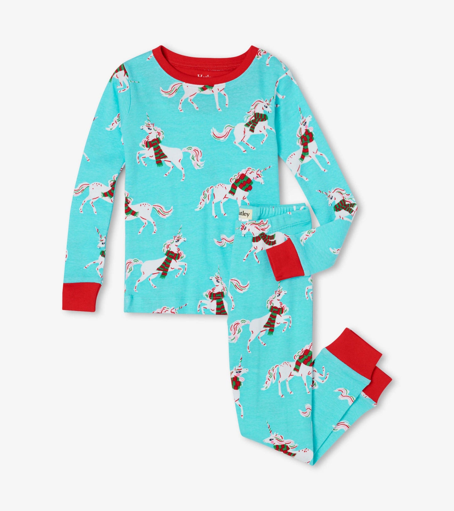 Turquoise organic cotton pyjama set featuring festive unicorns, red cuffs, and a comfortable fit for kids.