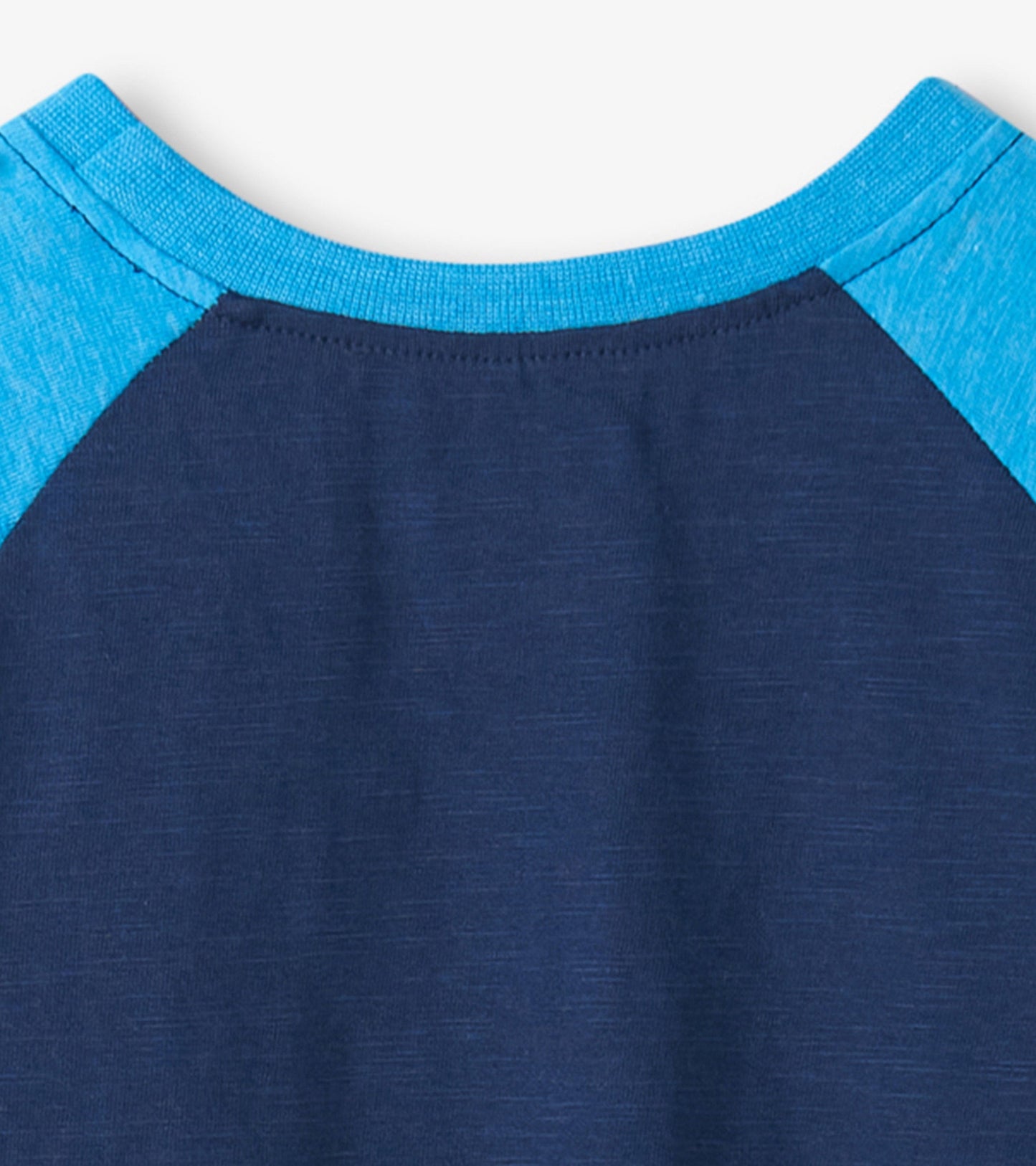 Navy blue raglan t-shirt with light blue sleeves, featuring a soft fabric and a crew neckline.