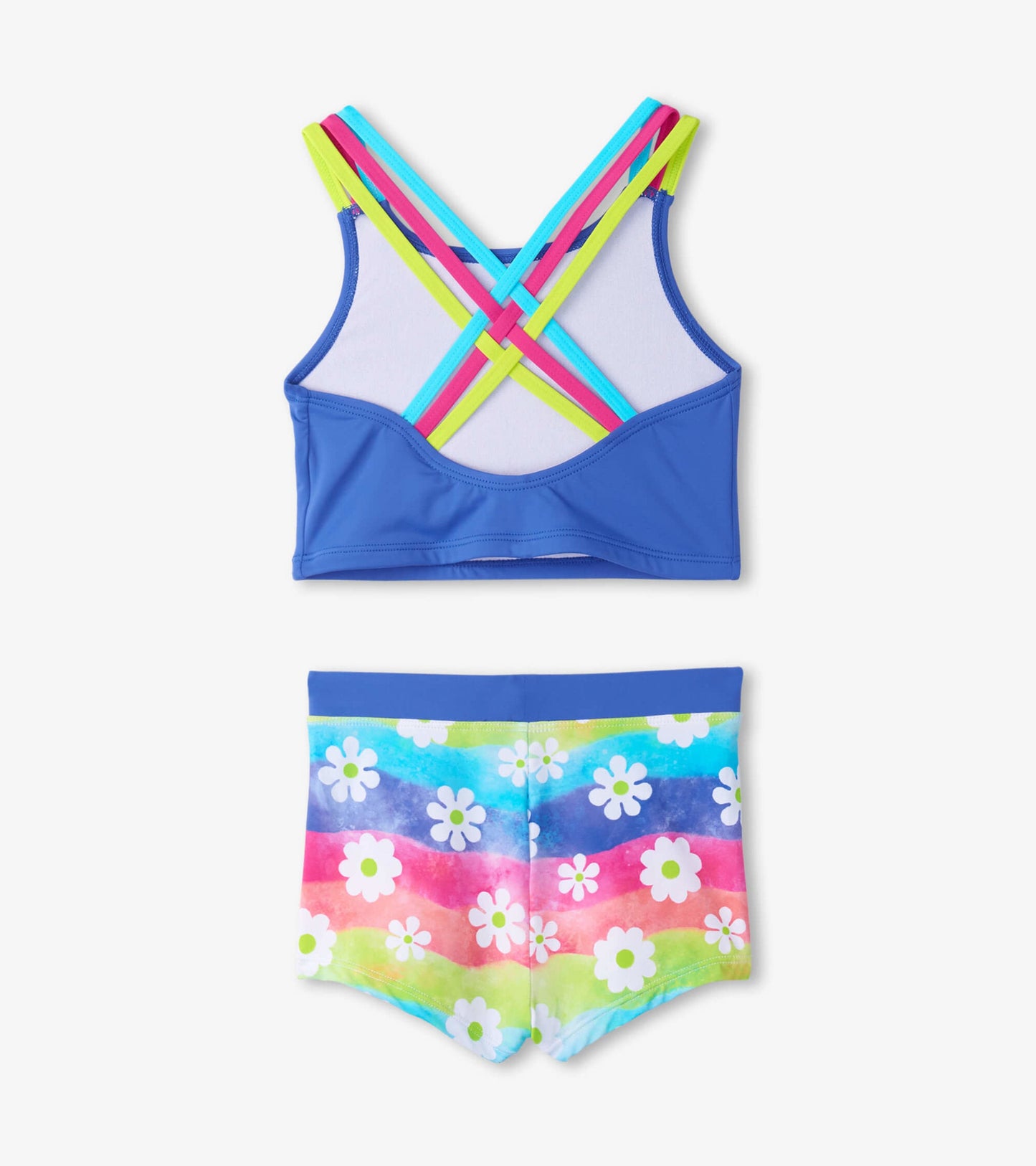 Two-piece bikini set featuring a blue crop top with colorful crisscross straps and rainbow flower-patterned shorts.