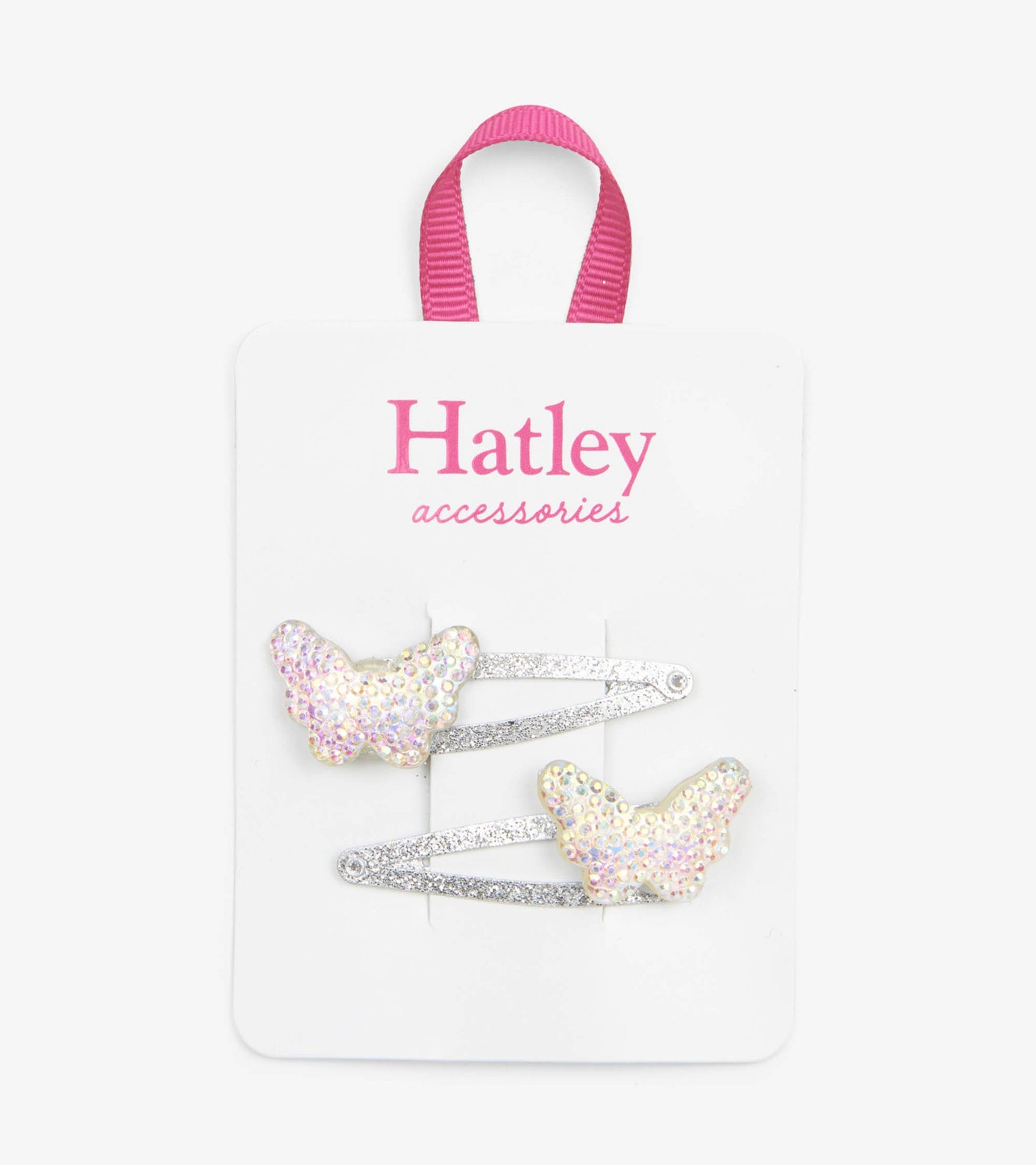 Two sparkling butterfly snap clips in pastel colors with glittery silver bases on a display card.
