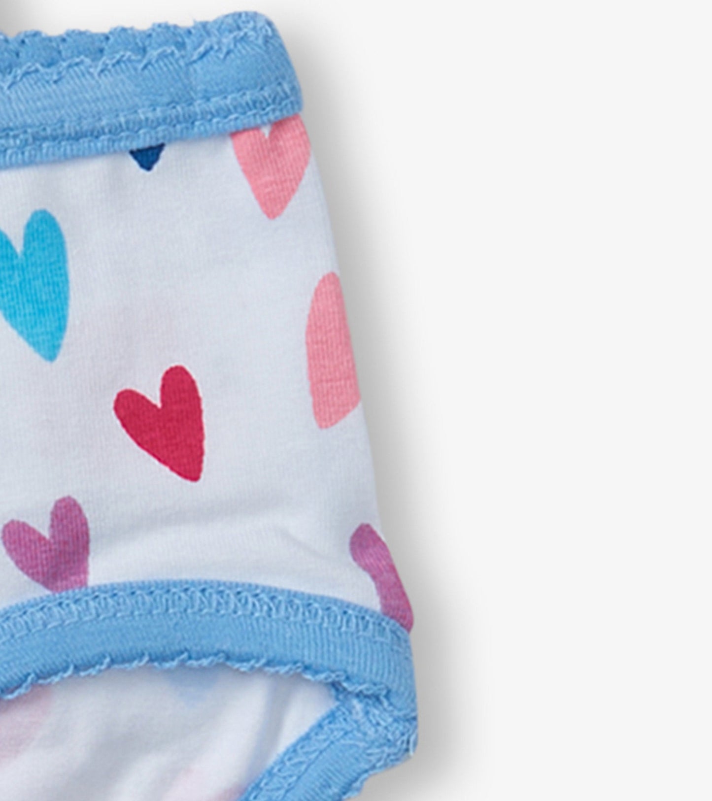 Girls' brief underwear featuring a white base with colorful heart patterns and a light blue waistband.