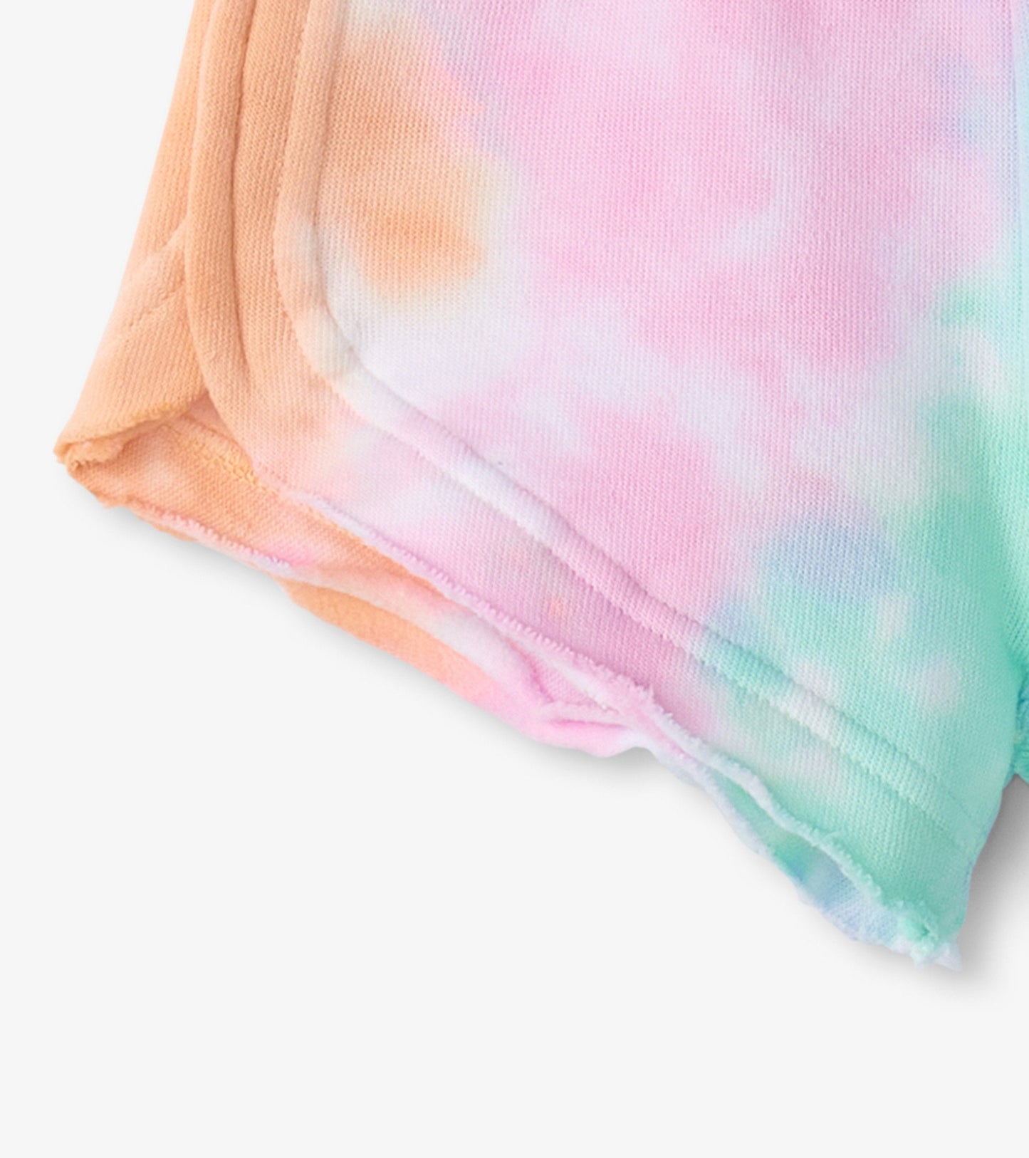 Colorful tie-dye pull-on shorts in pastel shades of pink, orange, and green, made from soft, lightweight fabric.