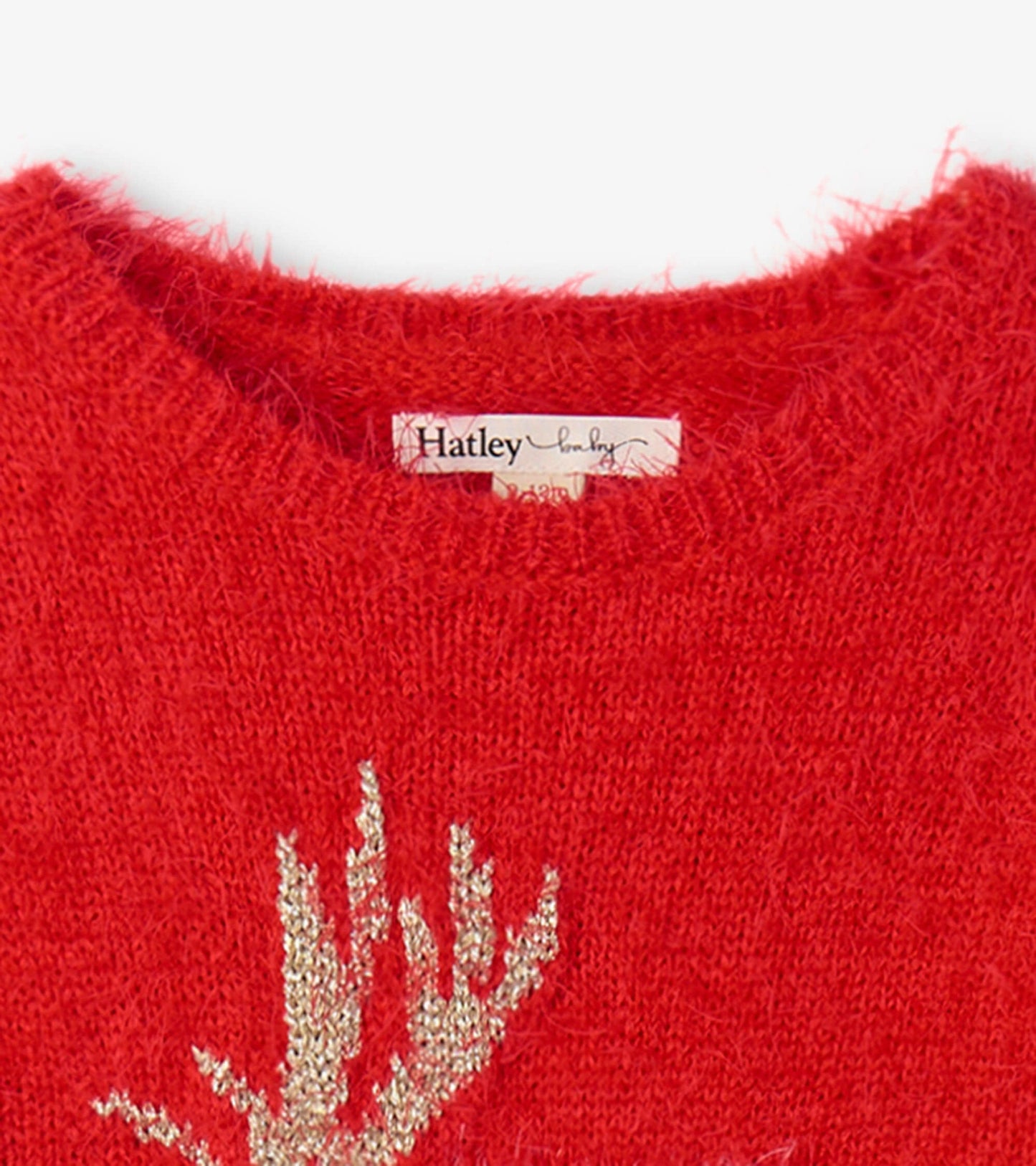 Red fuzzy sweater dress featuring a gold reindeer antler design, perfect for festive occasions.