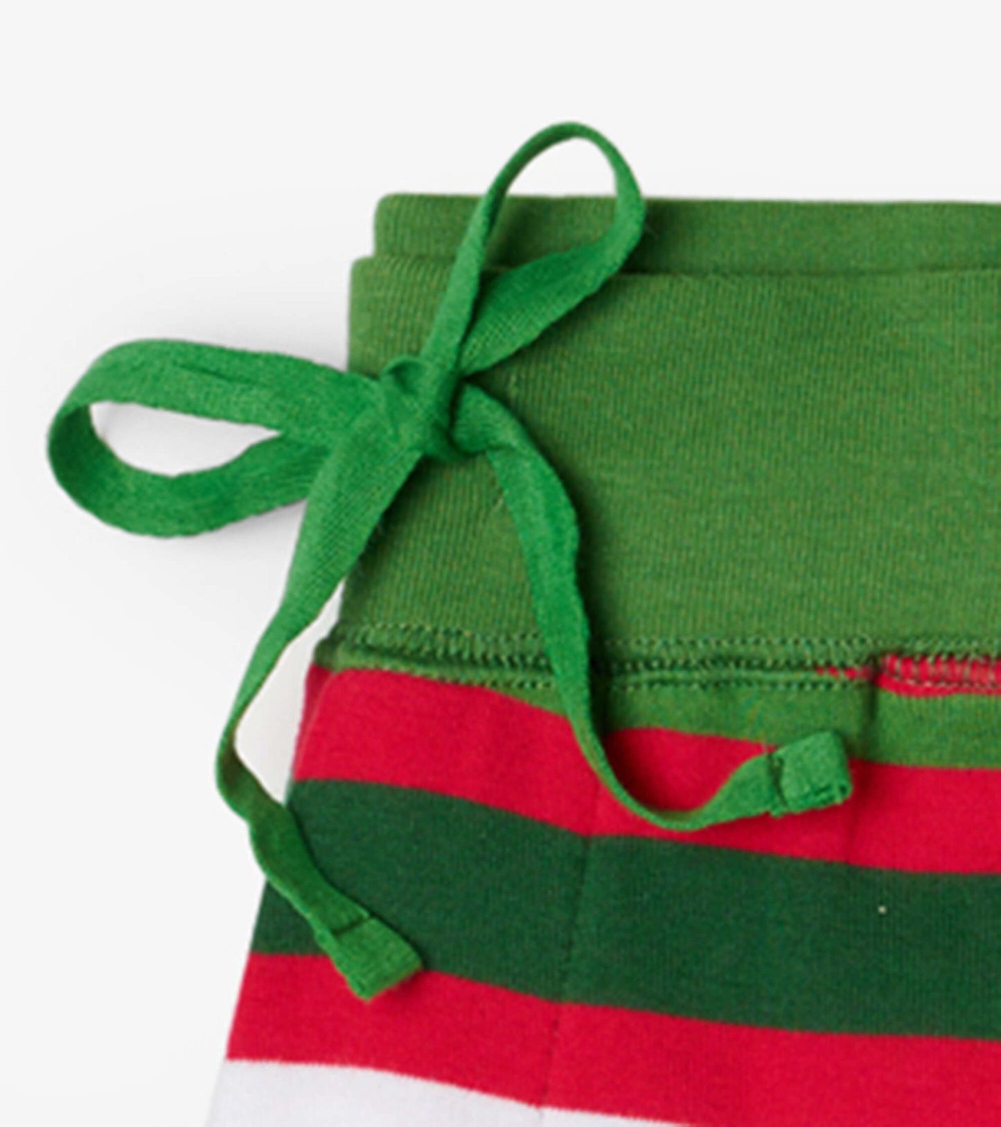 Green waistband with a tie and red and white candy cane stripes on the pants.