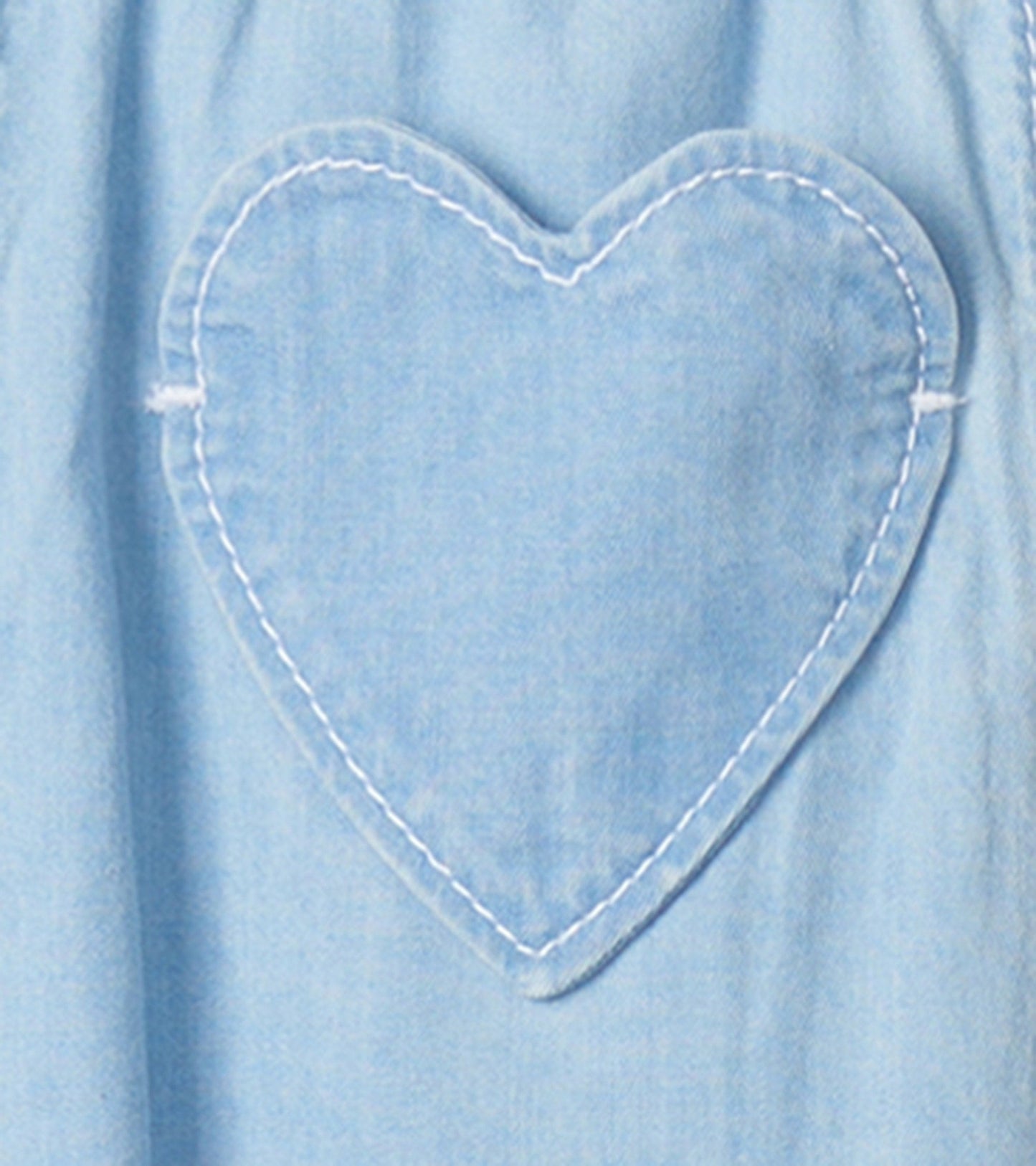Light blue denim baggy pants for baby girls featuring a heart-shaped patch on the front.