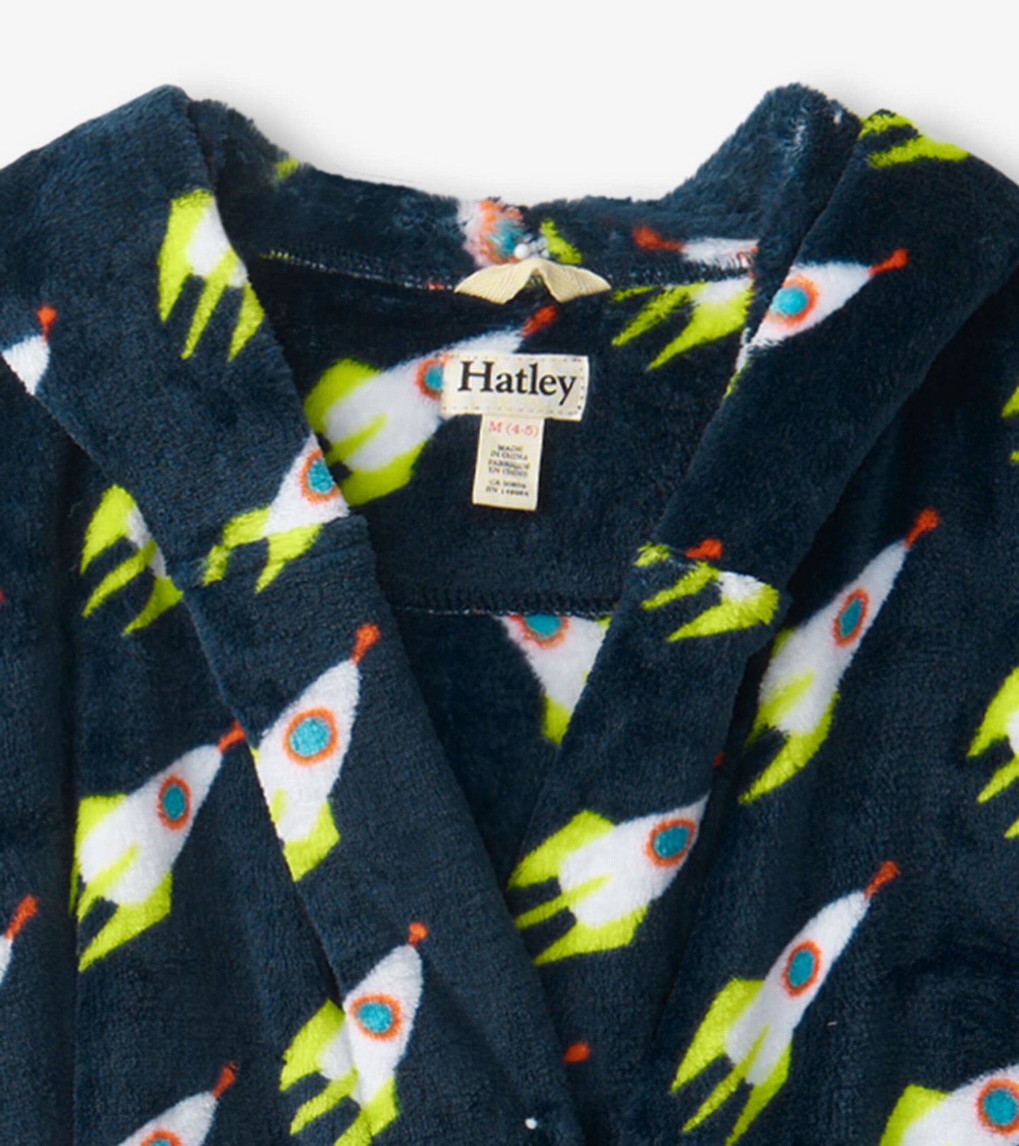 Navy fleece robe featuring colorful rocket patterns, designed for kids with a cozy hood and tie closure.
