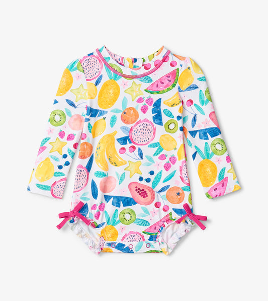Long-sleeve baby rashguard swimsuit featuring a colorful fruit print with pink accents and side ties.