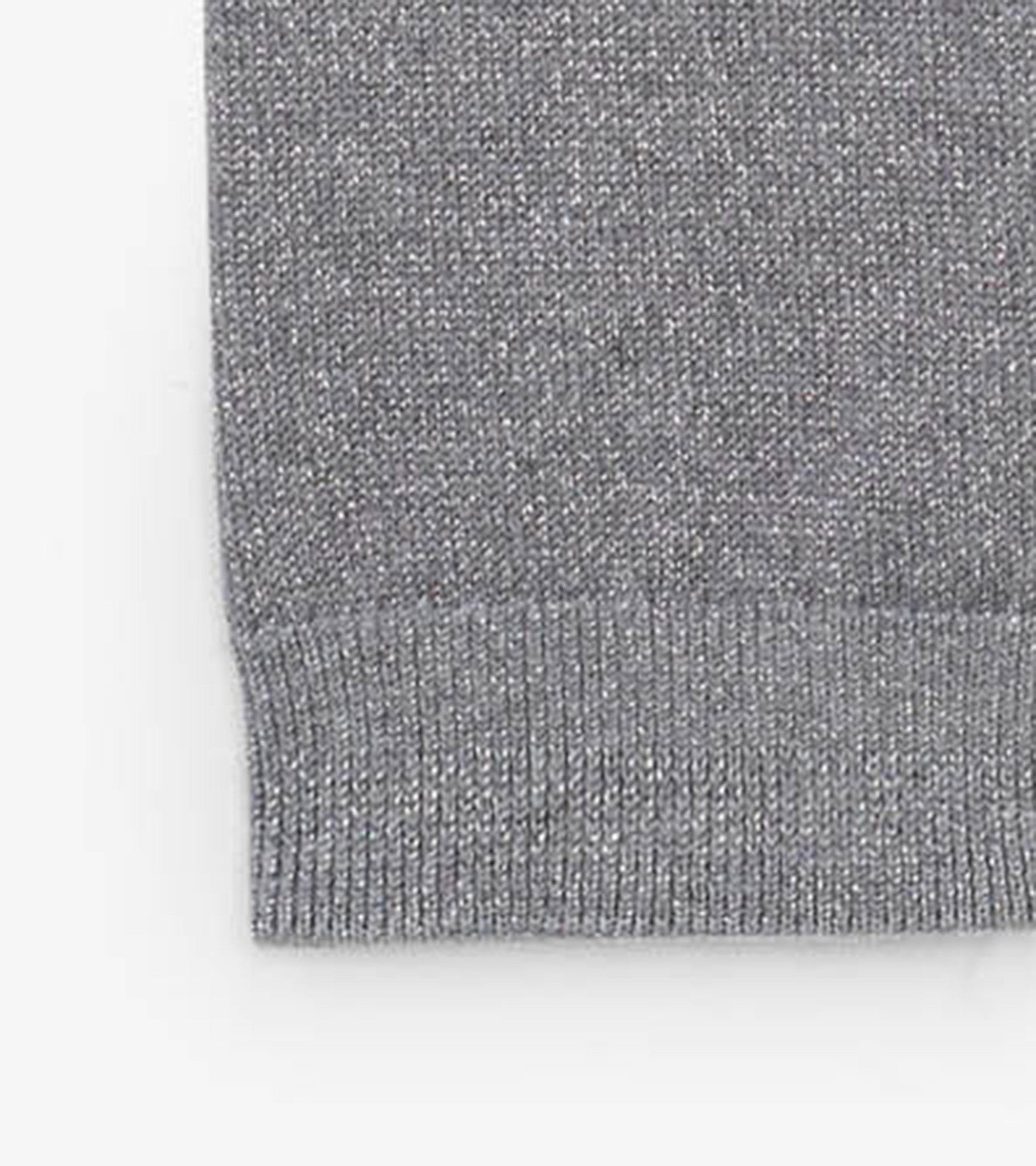 Silver glitter cable knit leggings with a ribbed waistband, suitable for infants.