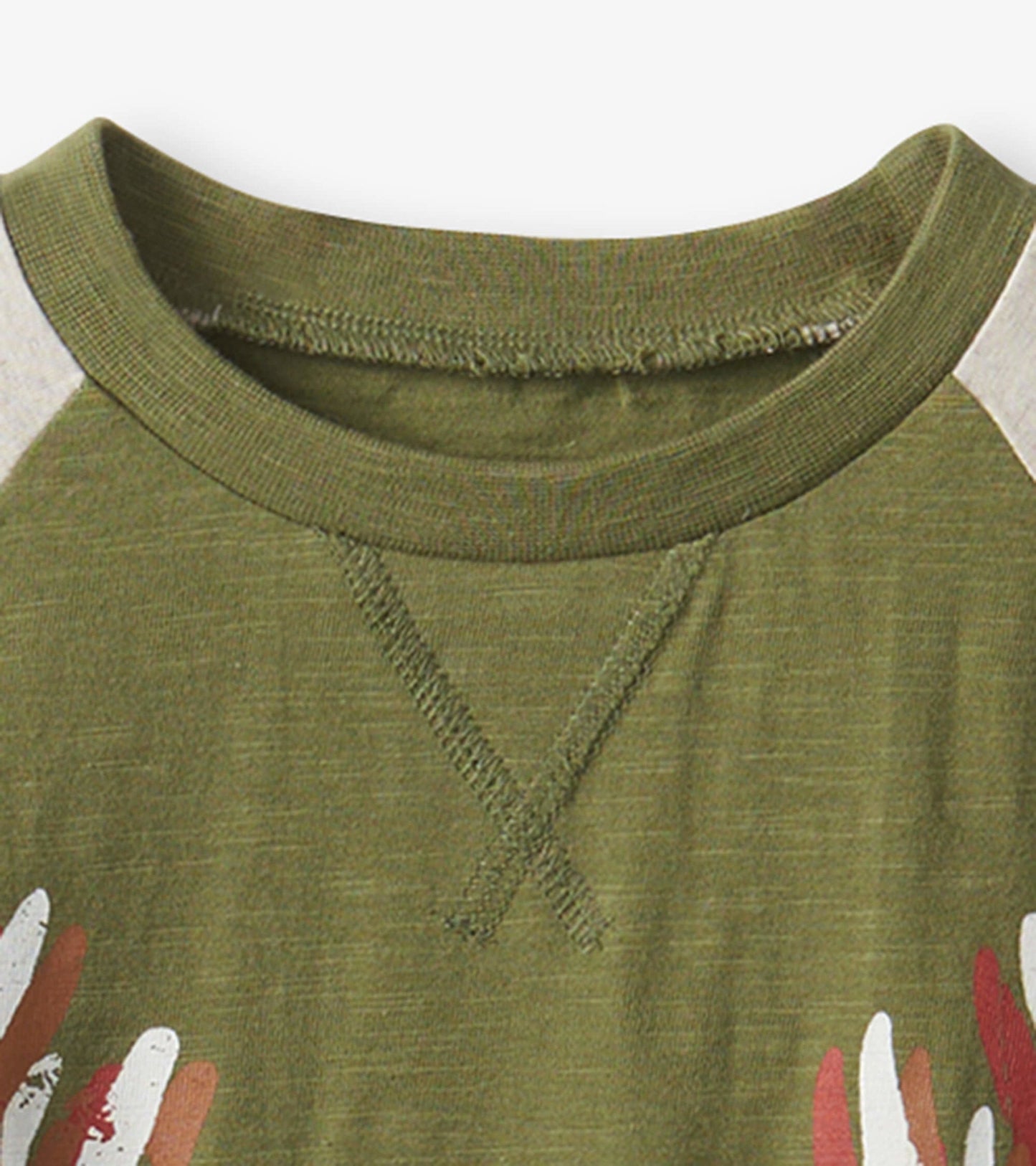 Olive green long sleeve t-shirt with a crew neck and colorful leaf print on the front.