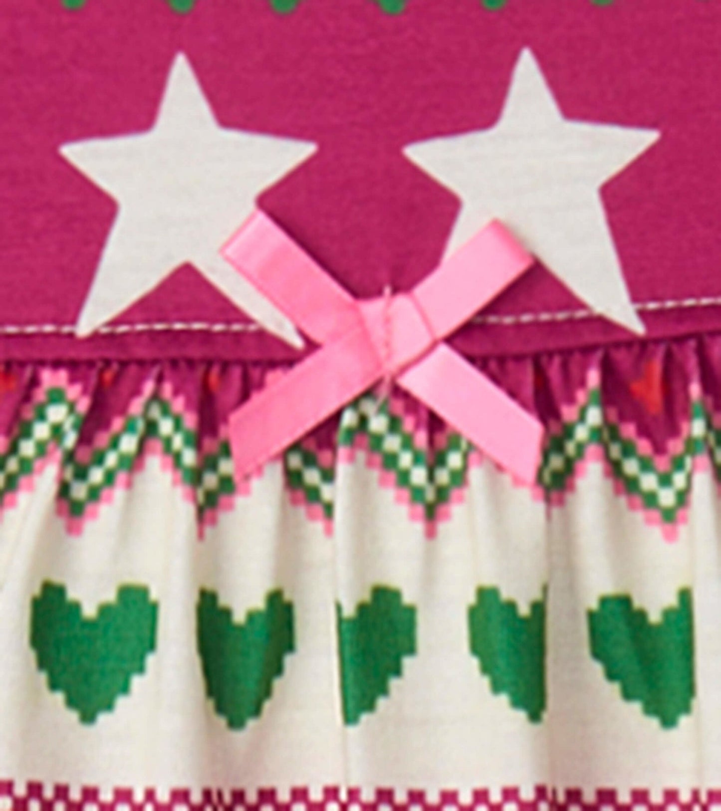 Long sleeve girls nightgown featuring a purple top with white stars and a patterned skirt with hearts and zigzags.