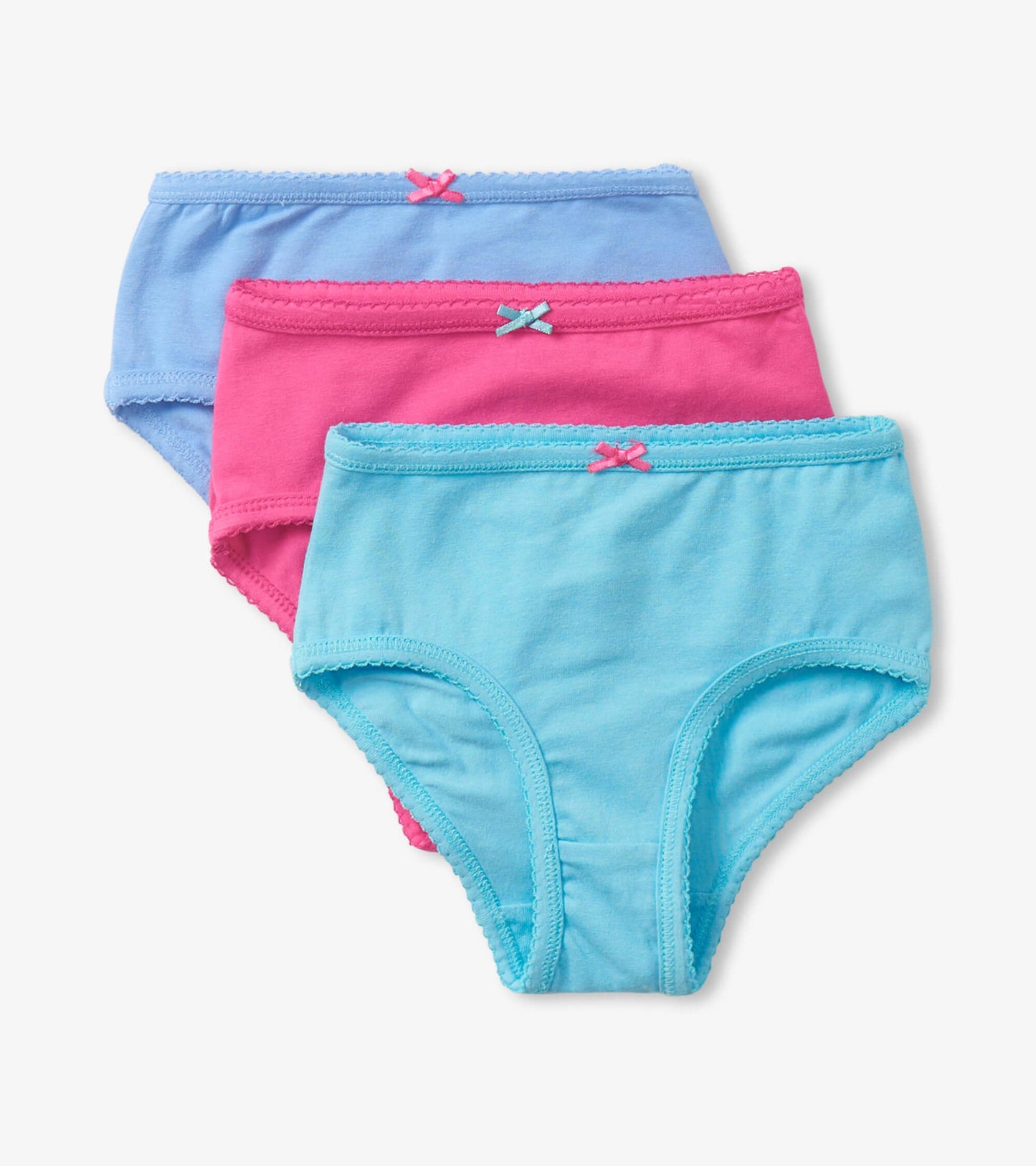 Three pairs of girls' brief underwear in pink, light blue, and blue, featuring decorative bows and soft cotton material.