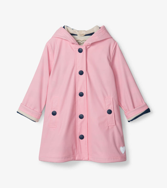 Pink button-up raincoat with navy buttons and striped lining, featuring a hood and front pockets.