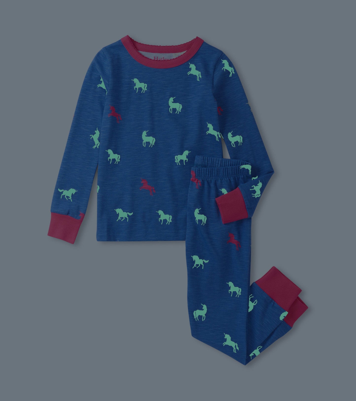 Blue pajama set featuring colorful unicorn patterns, with long sleeves and elastic waistband pants.