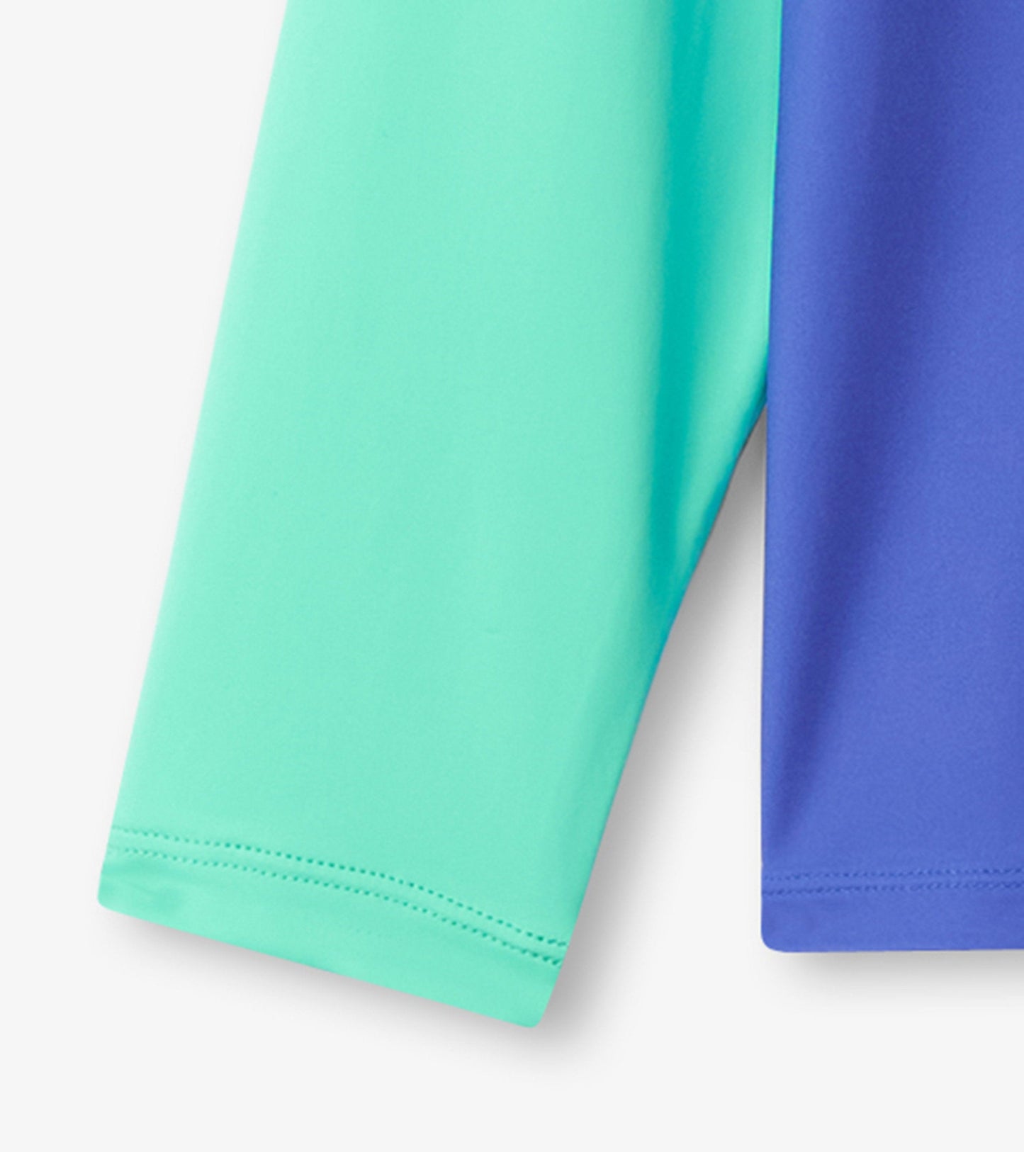Long sleeve rashguard featuring a kaleidoscope pattern in turquoise and purple, made from lightweight, stretchy material.