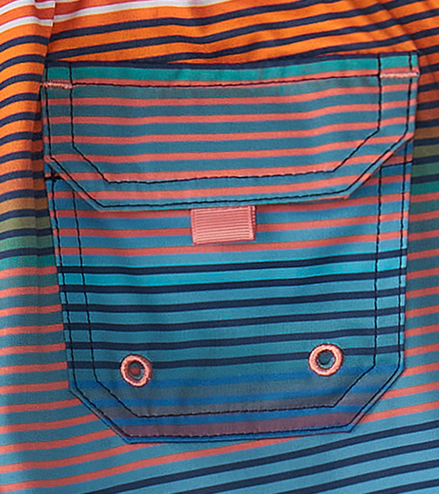 Multicolored striped quick-dry shorts featuring a back pocket with snap closure and grommets.