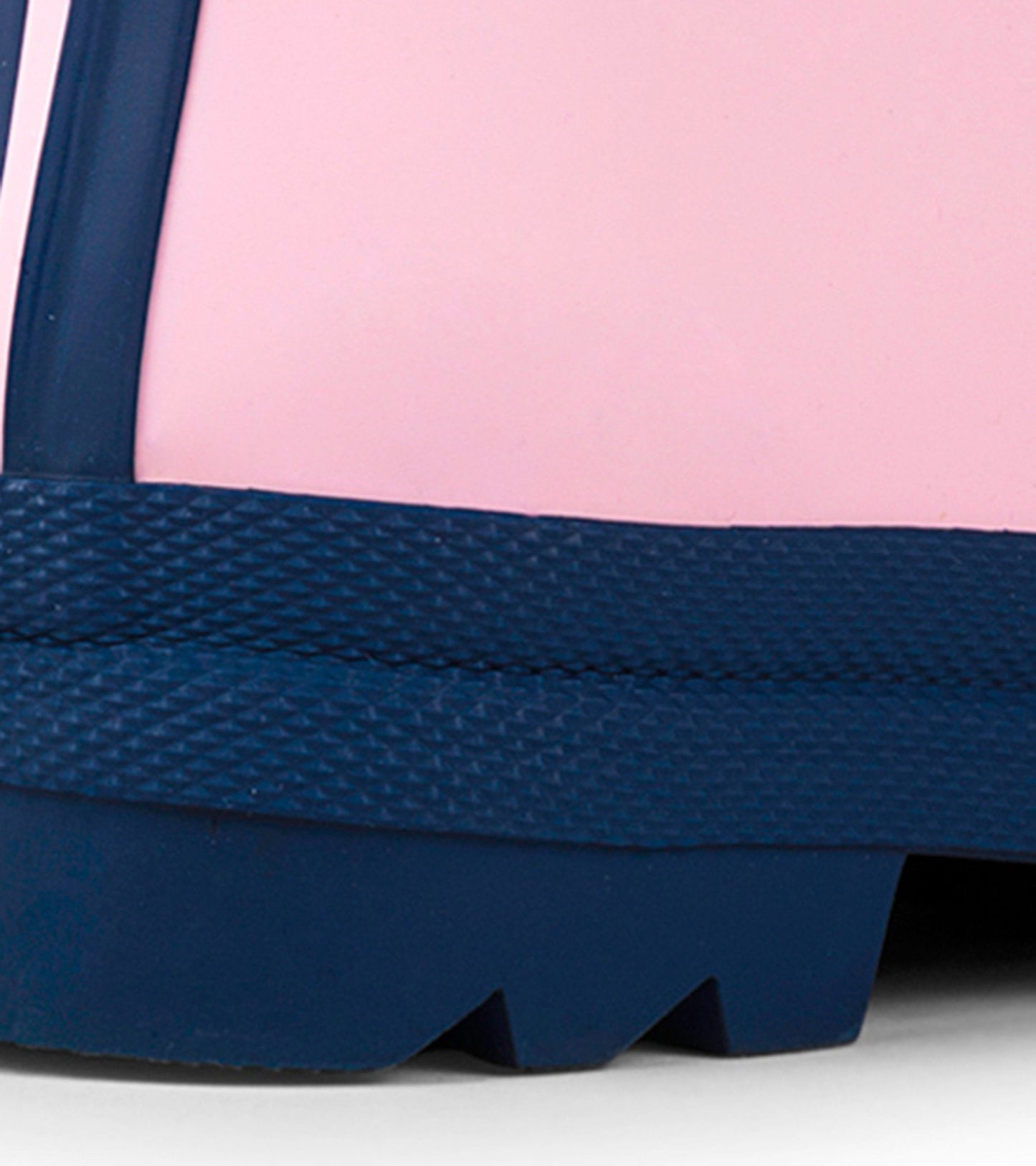 Pink and navy matte wellies with a textured sole, designed for kids, suitable for wet weather.