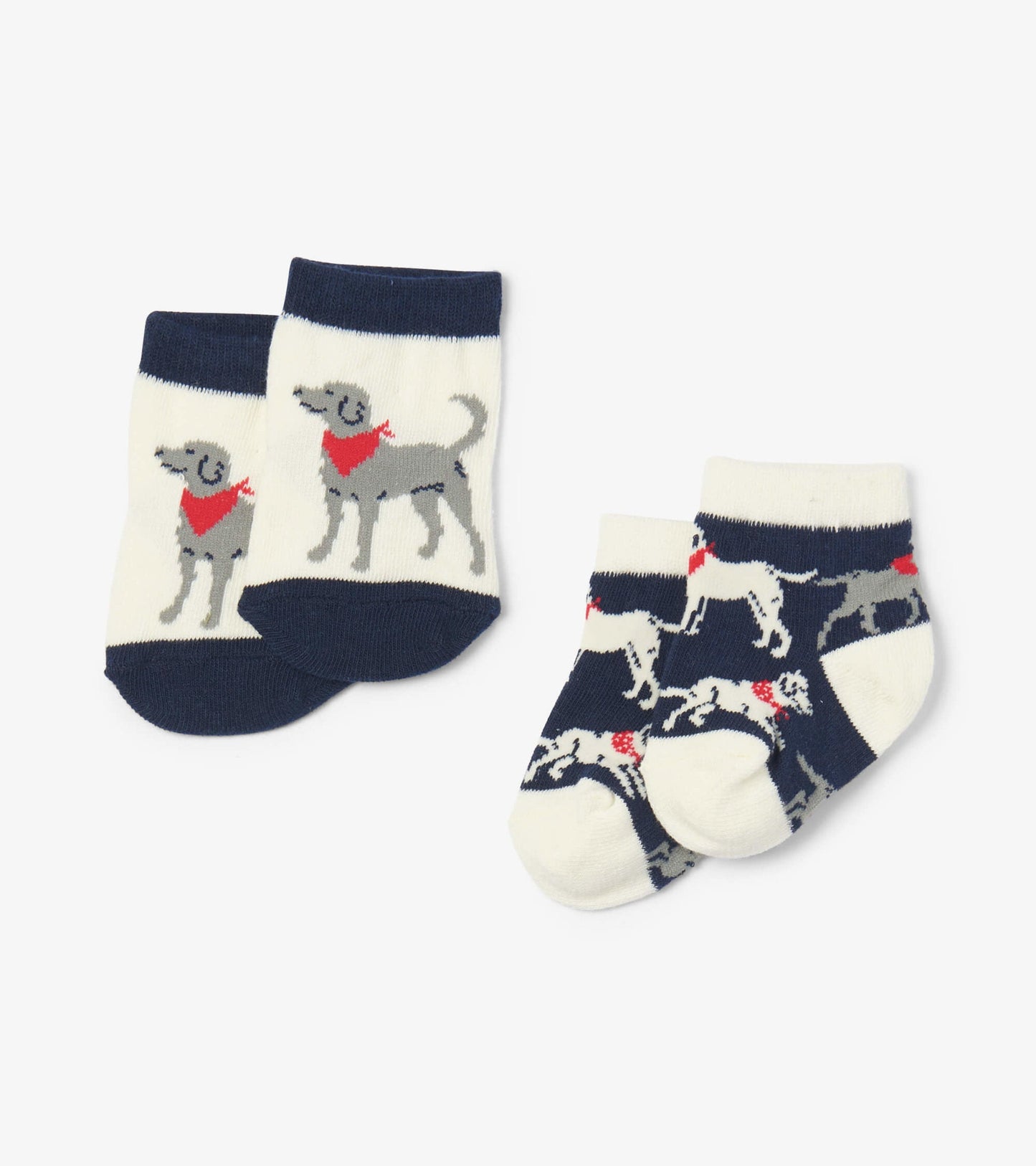 Navy and cream baby socks featuring playful dog designs, perfect for infants aged 0-24 months.