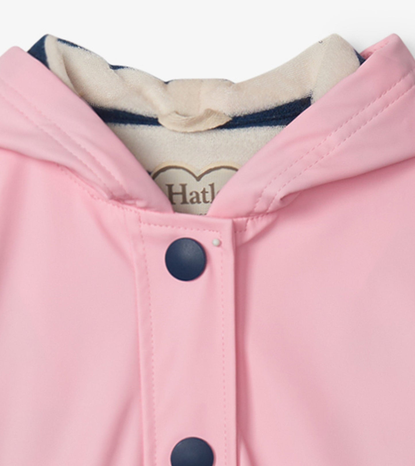 Pink button-up raincoat with a navy hood lining and navy buttons, designed for girls.