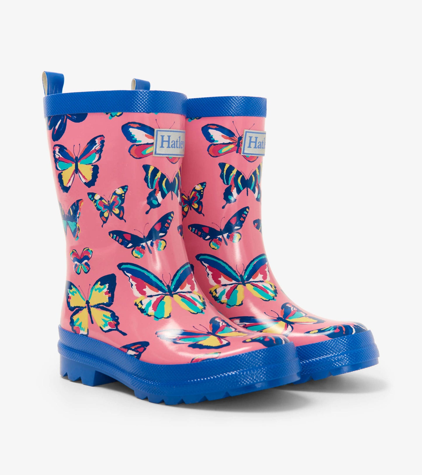 Pink rubber wellies featuring a colorful butterfly pattern and blue trim, designed for kids.