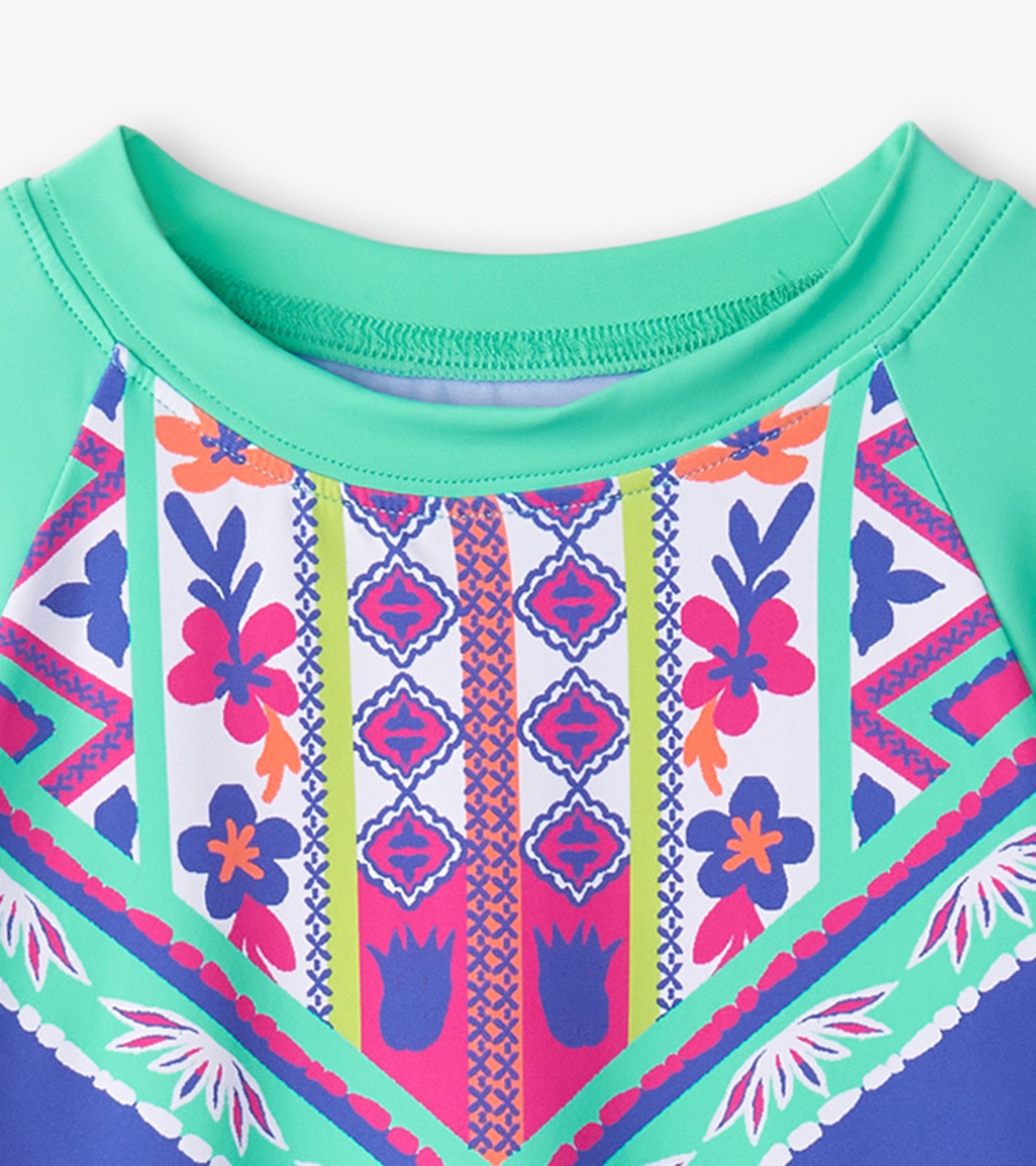 Long sleeve rashguard featuring a vibrant kaleidoscope pattern in pink, blue, and green with a crew neckline.