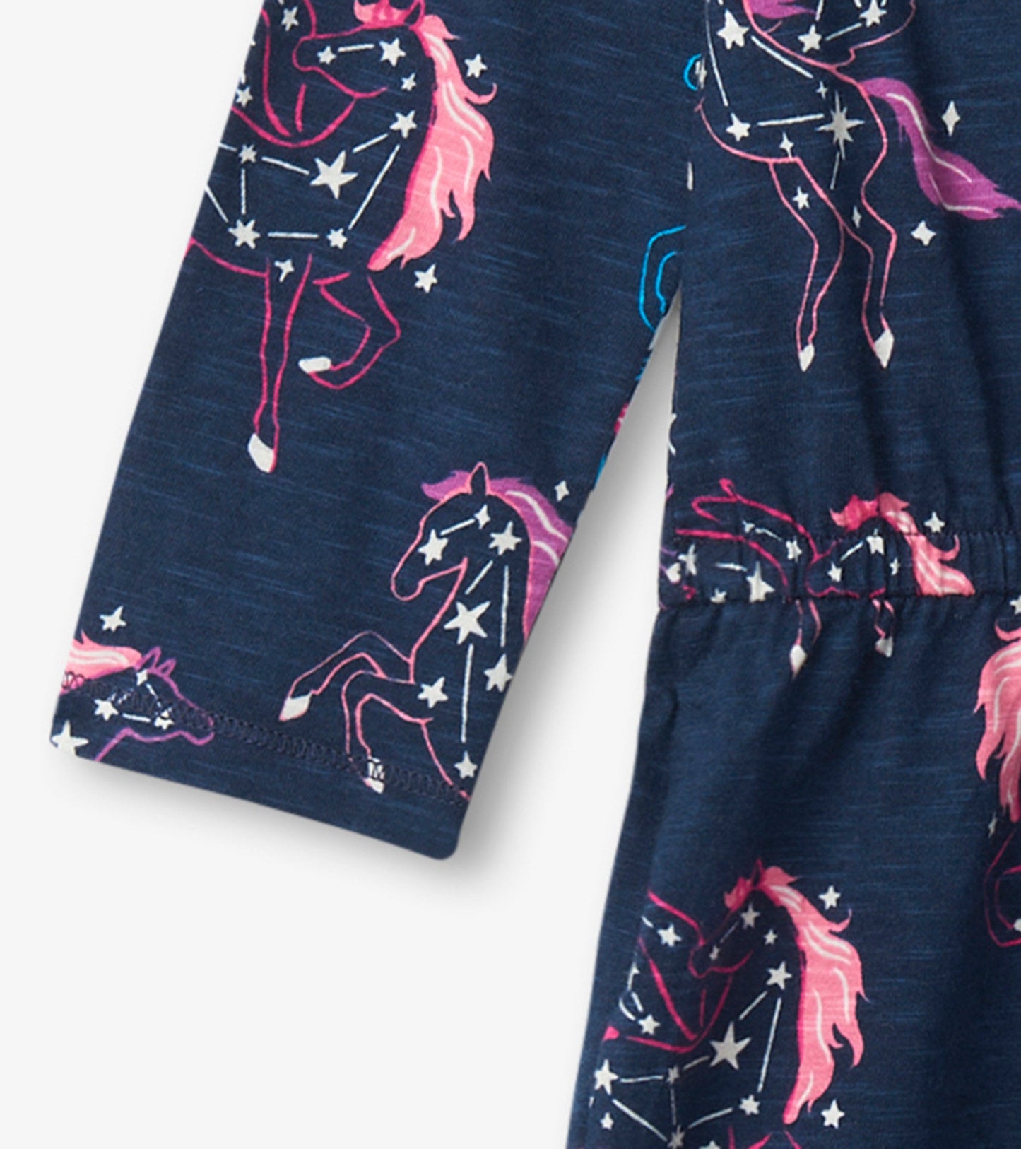 Navy drop waist dress featuring colorful unicorn and star print, with long sleeves and elastic waist for comfort.