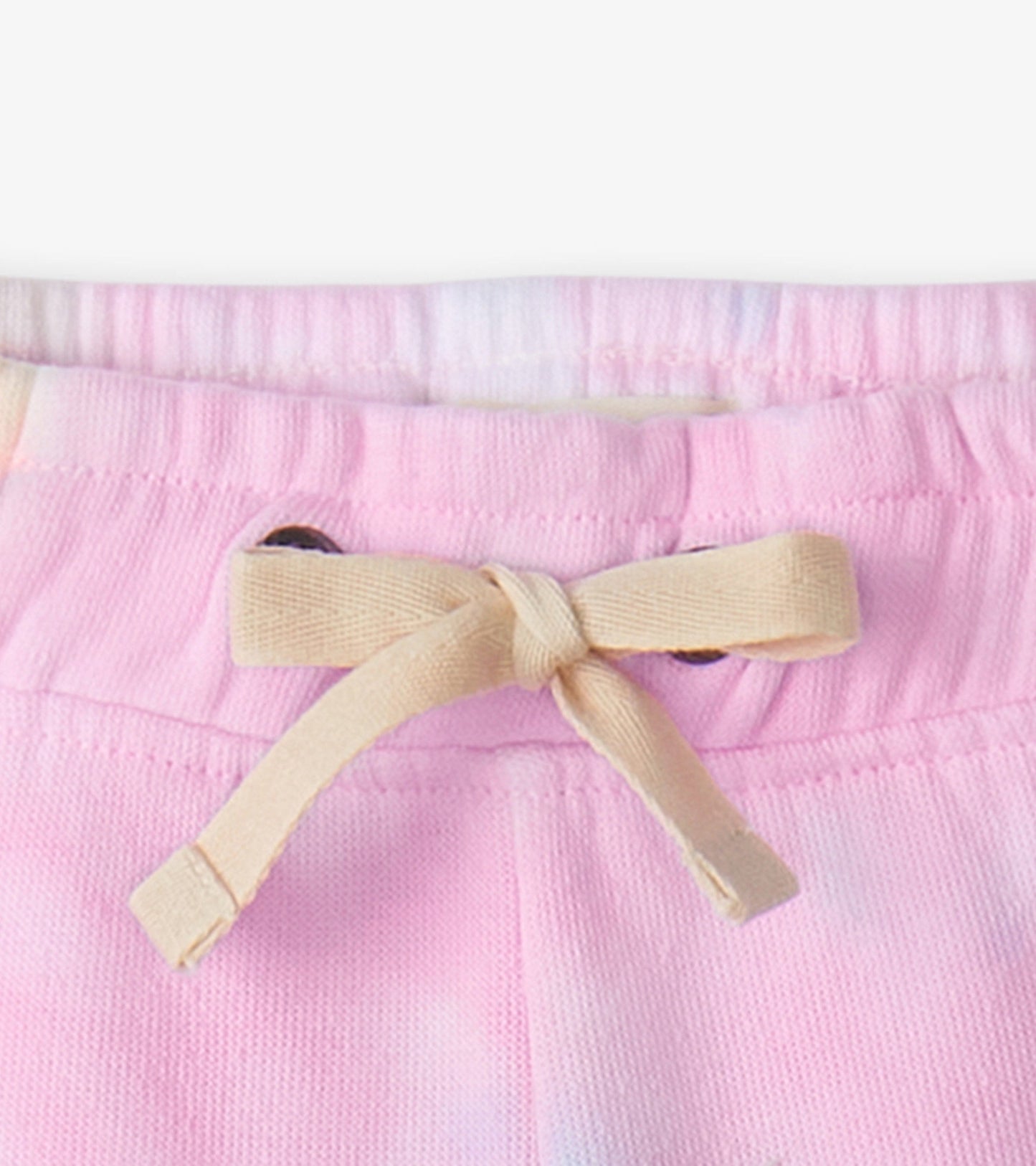 Light pink pull-on shorts with a drawstring waist, made from soft fabric, ideal for summer wear.