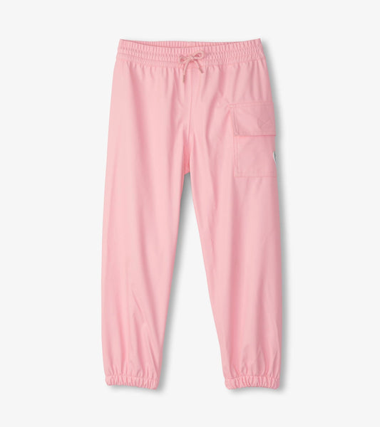Light pink kids' rain pants with elastic waistband and side pocket, designed for outdoor play in wet weather.