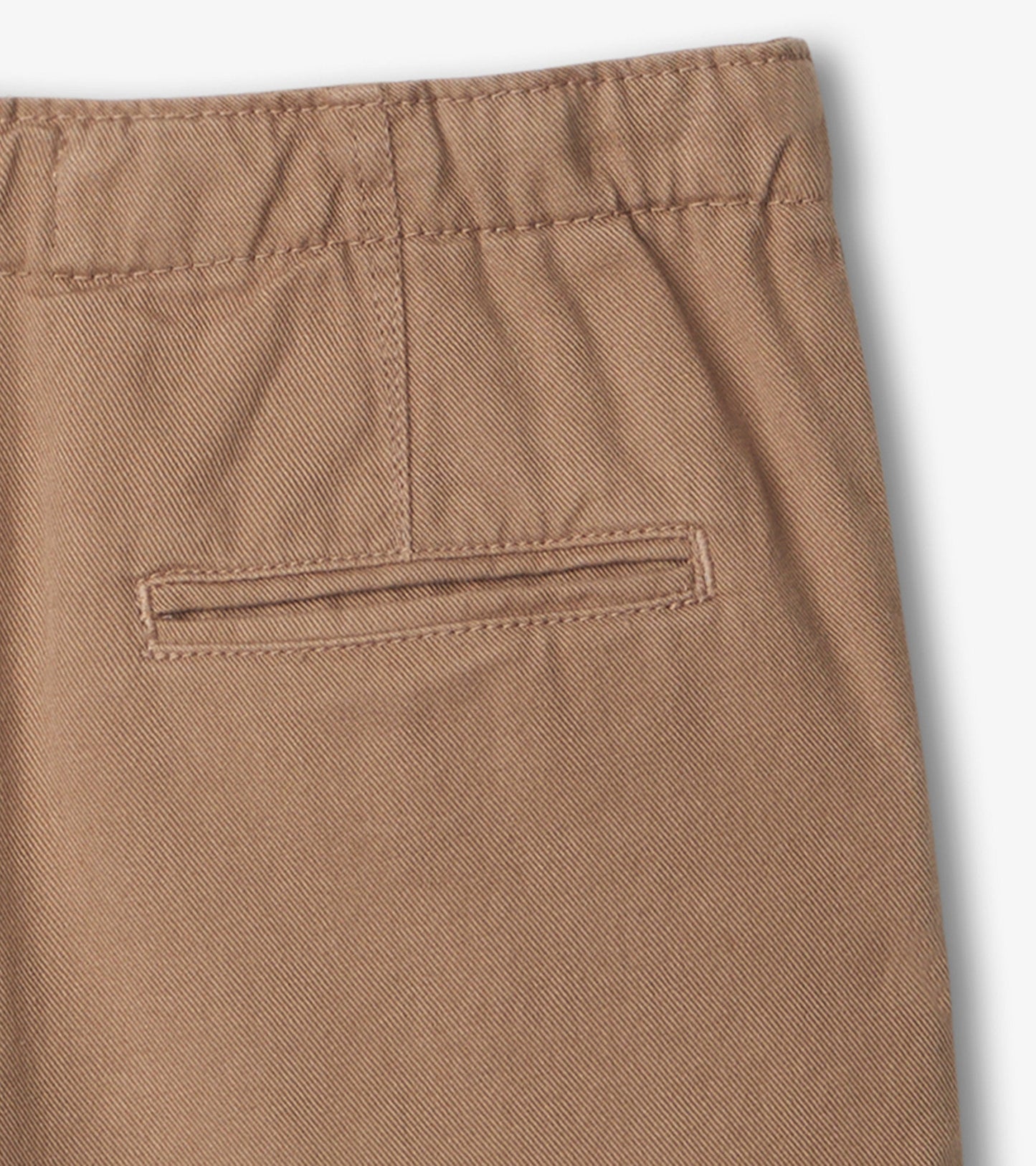 Khaki twill shorts featuring a back pocket and elastic waistband, suitable for casual wear.