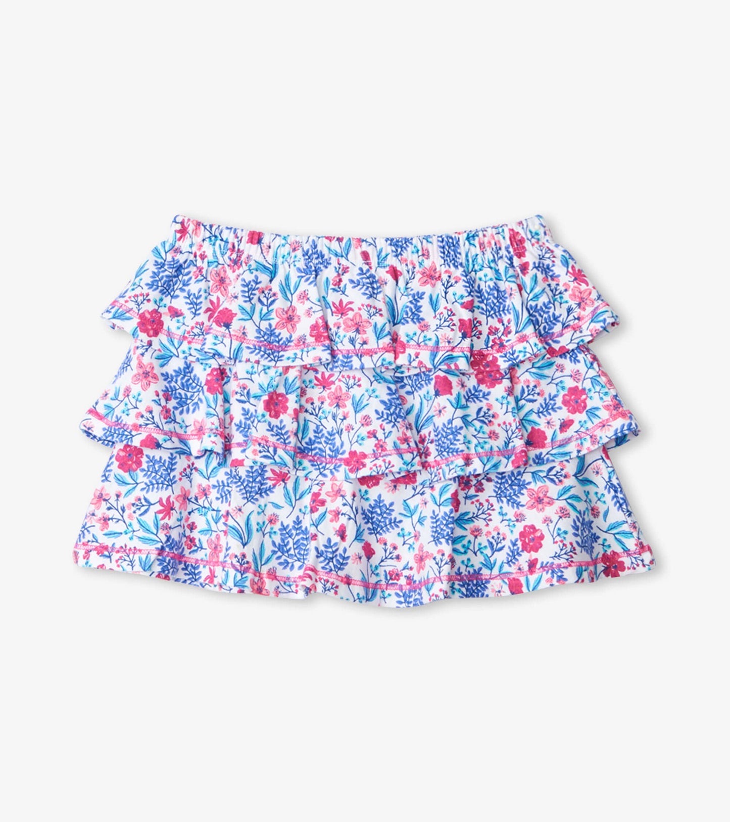 Tiered skirt featuring a floral pattern in pink and blue on a white background, with an elastic waistband.