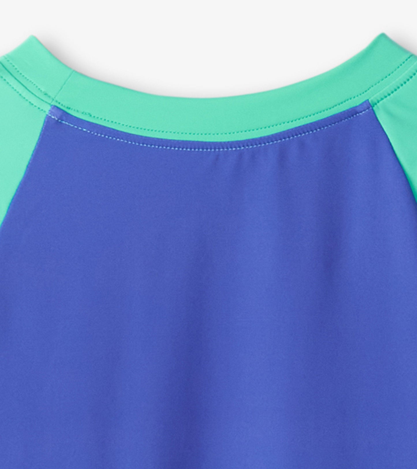 Long sleeve rashguard featuring a blue body with green accents, designed for kids' swimwear.