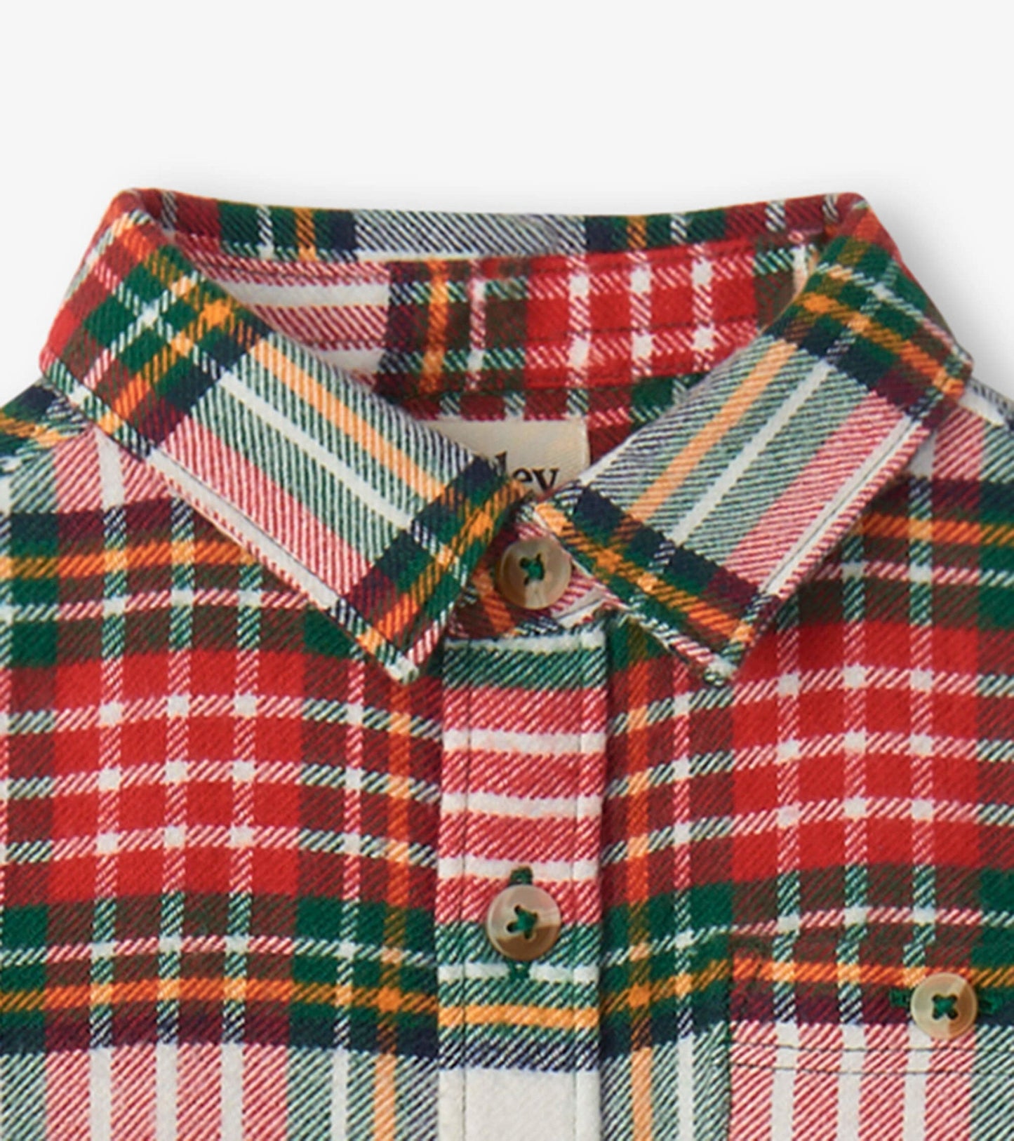 Red, green, and yellow plaid button-down shirt for babies, featuring a collar and wooden buttons.