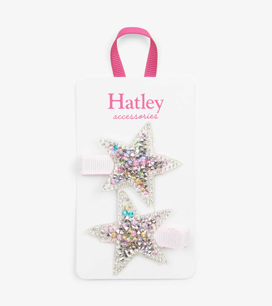 Two star-shaped hair clips adorned with colorful rhinestones on a pink ribbon.