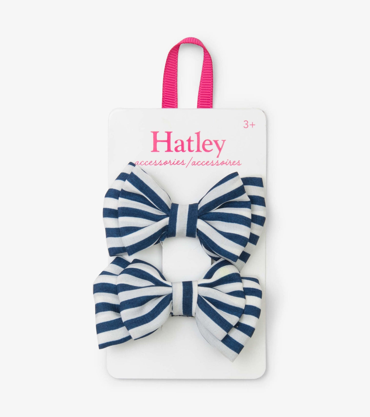 Navy and white striped hair clips in a bow shape, displayed on a card with a pink hanging loop.