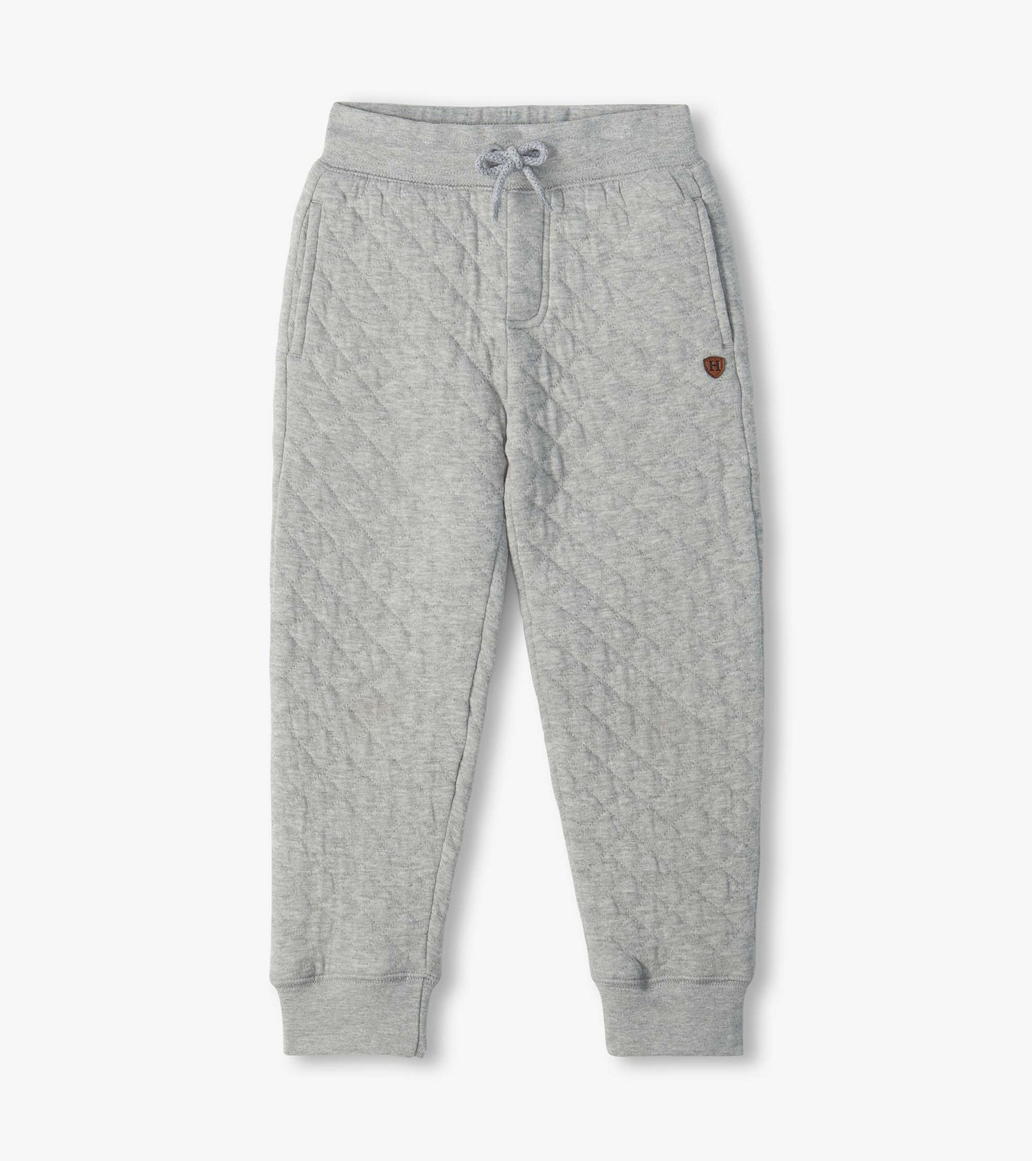Grey quilted jogger pants with drawstring waist, side pockets, cuffed ankles, and small H patch