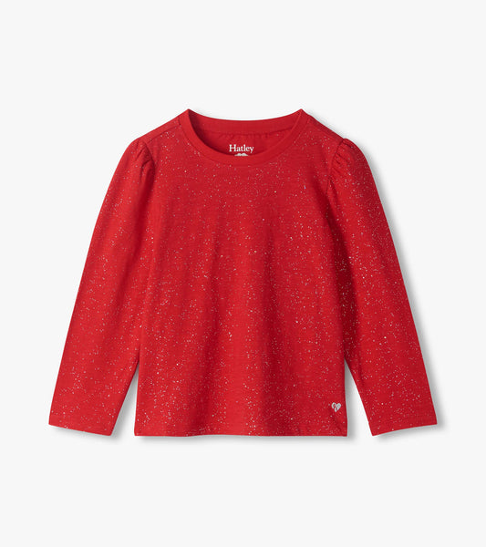 Front view of a red long sleeve tee with silver speckles, puff shoulders, and a small heart near the hem