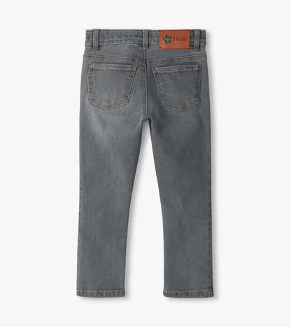 Back view of charcoal grey jeans with two back pockets and a Hatley logo patch on the waistband