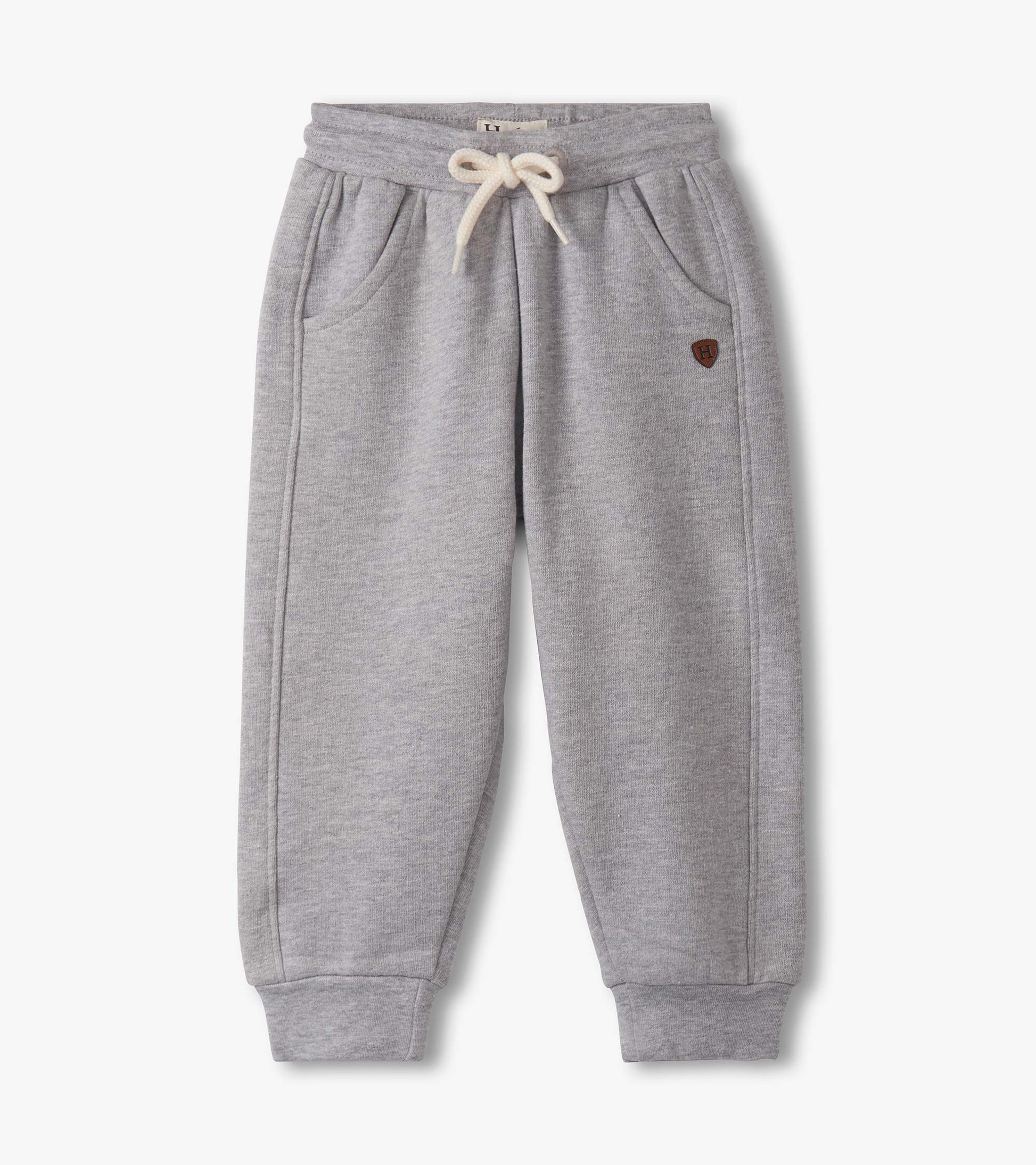 Grey athletic track pants for baby and toddler boys, featuring an elastic waistband and side pockets.