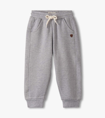 Grey athletic track pants for baby and toddler boys, featuring an elastic waistband and side pockets.
