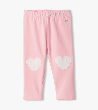 Front view of orchid pink infant leggings with white heart knee patches and an elastic waistband