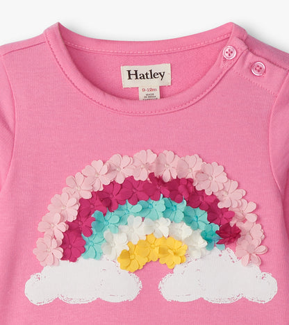 Pink toddler dress with rainbow and cloud floral applique, round neck, and shoulder buttons, front view