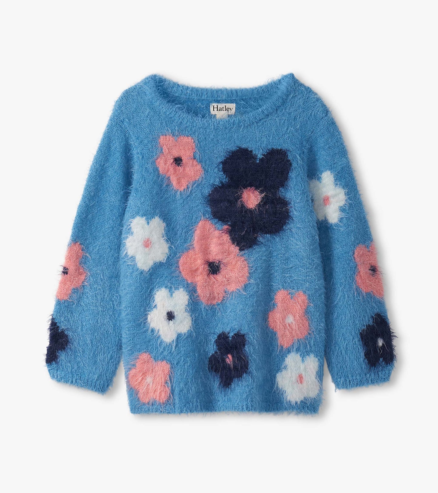 Furry blue sweater featuring colorful floral clusters in pink, white, and navy. Long sleeves and a round neckline.