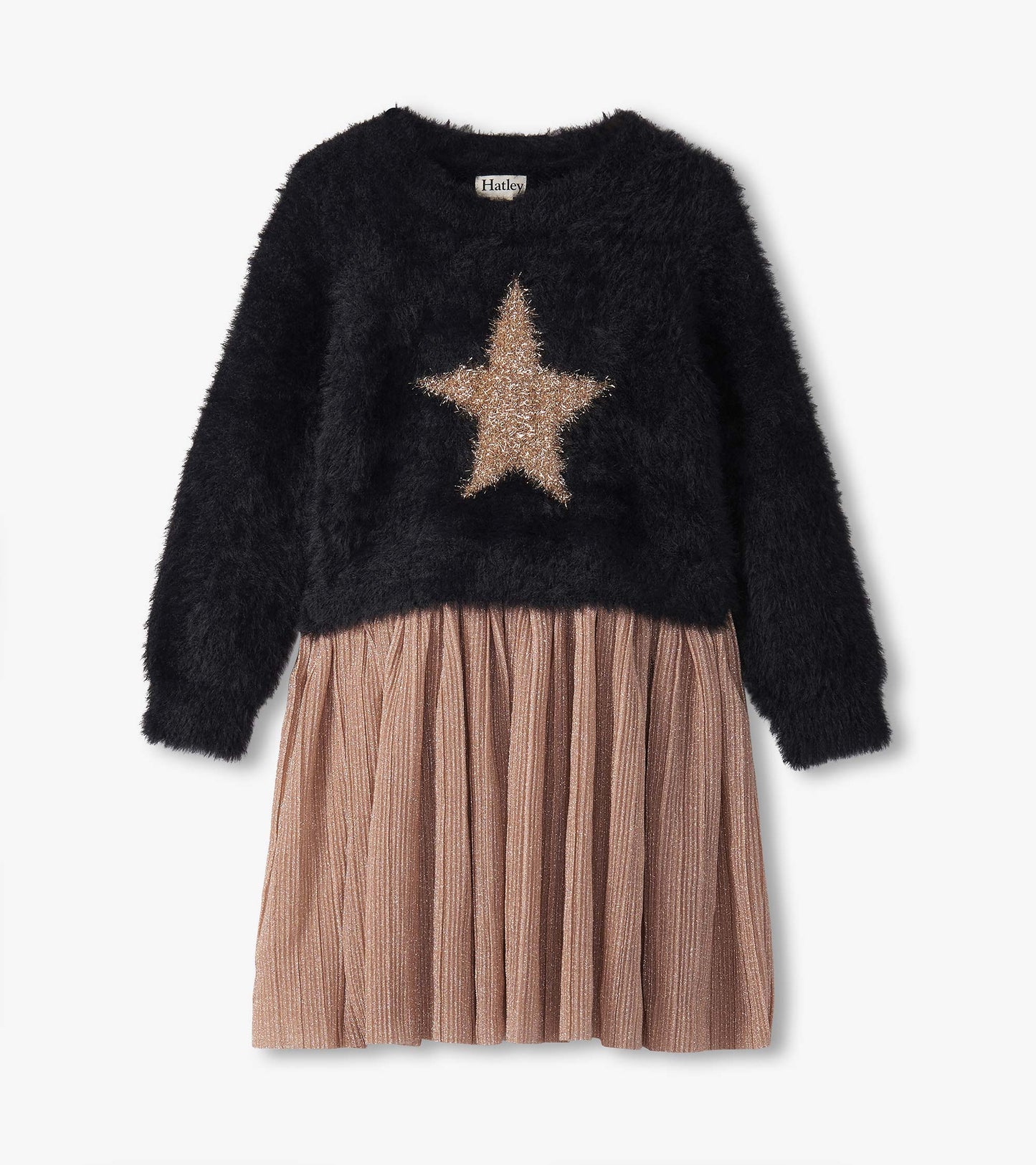 Black fuzzy top with a gold star design, paired with a pleated, shimmery pink skirt.