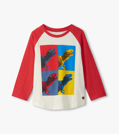 Long sleeve raglan t-shirt featuring a colorful dinosaur graphic on a cream background with red sleeves.