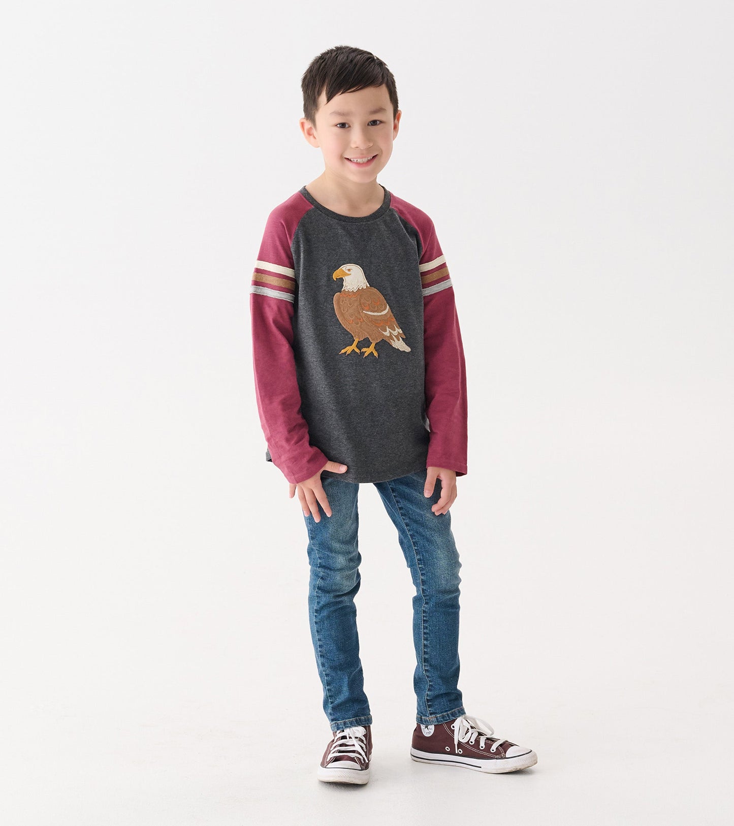 Long sleeve raglan t-shirt with a gray body and maroon sleeves, featuring an eagle graphic on the front.